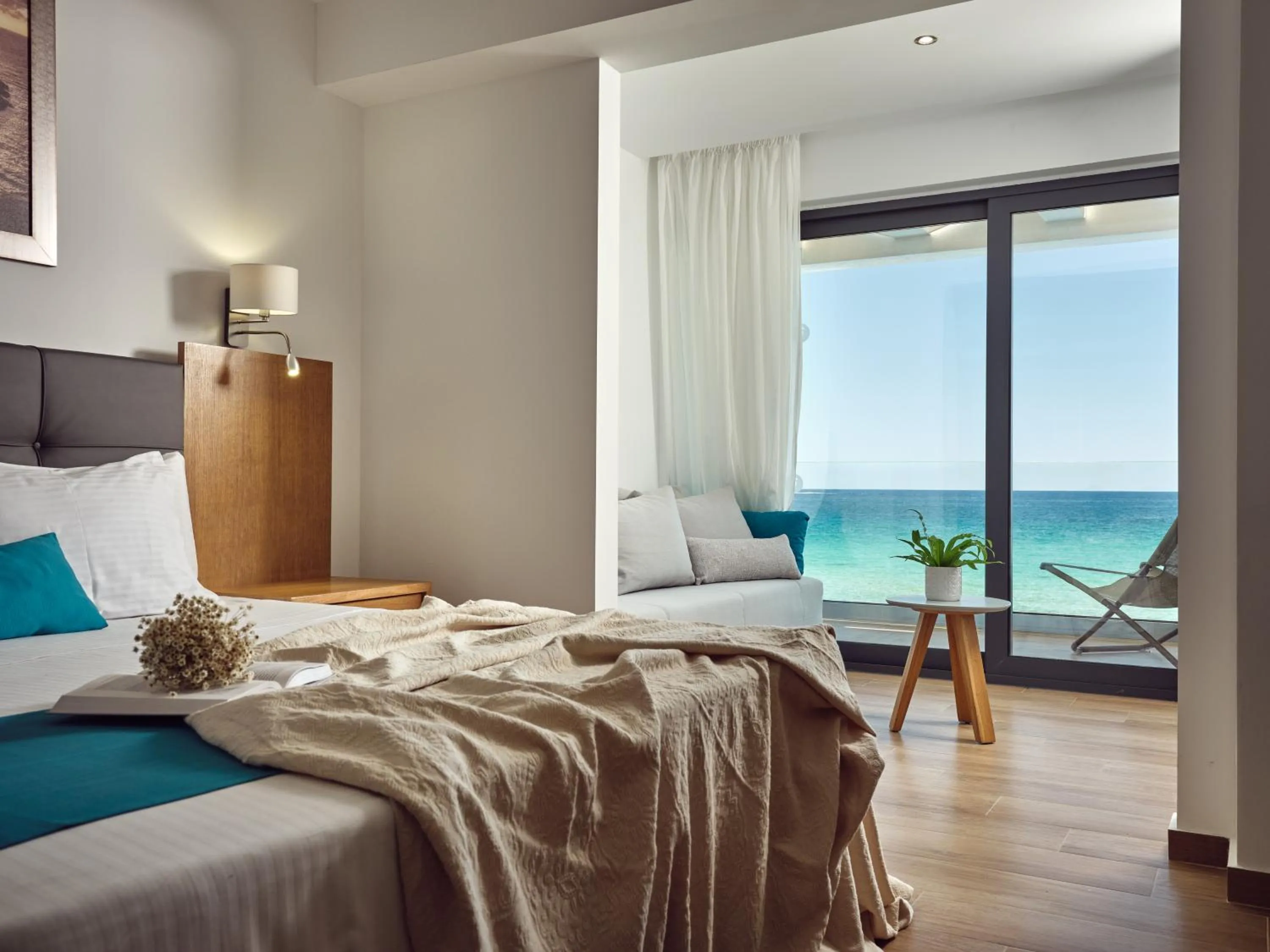 Bedroom, Bed in Cavo Orient Beach Hotel & Suites