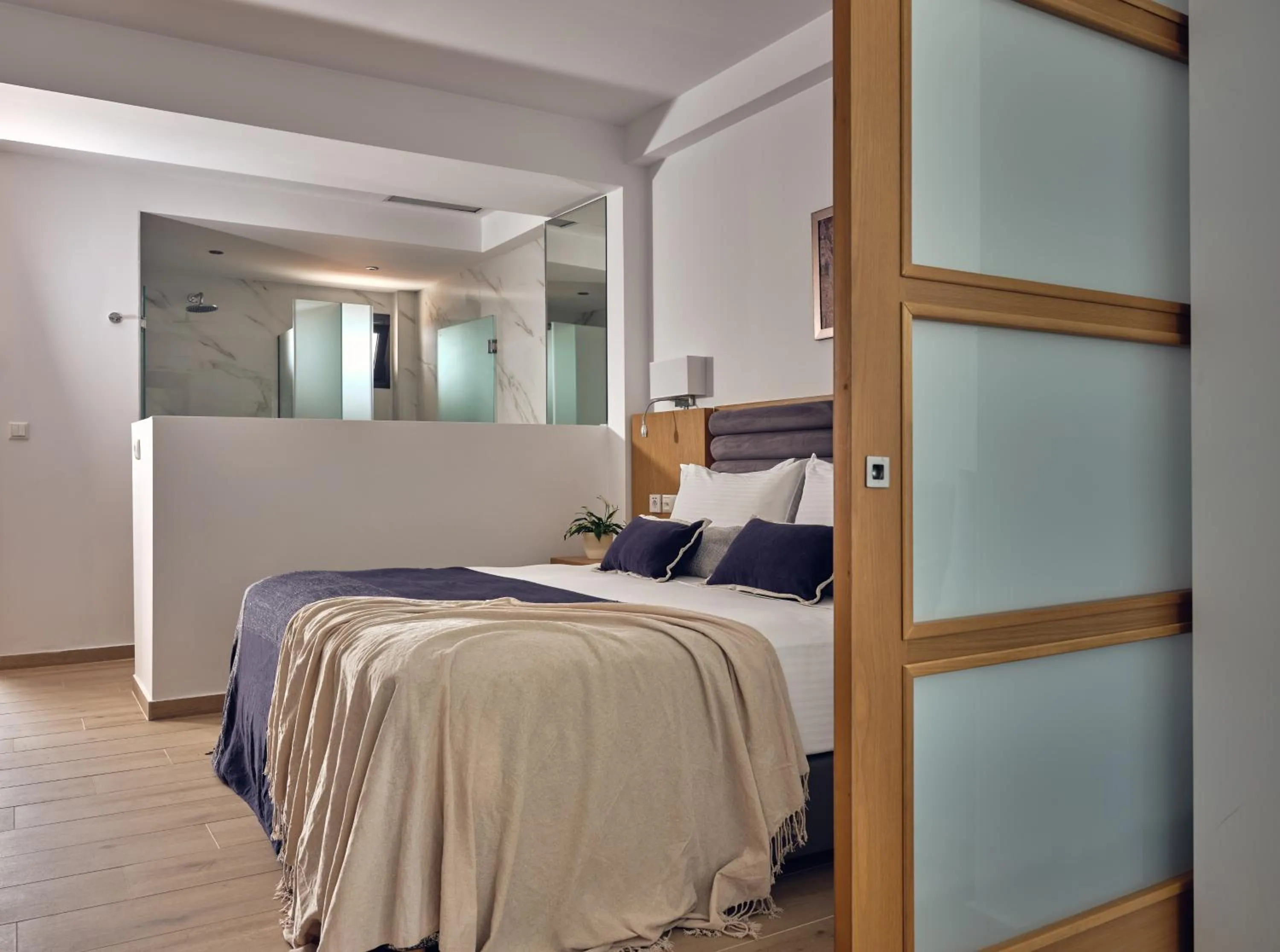 Bedroom, Bed in Cavo Orient Beach Hotel & Suites