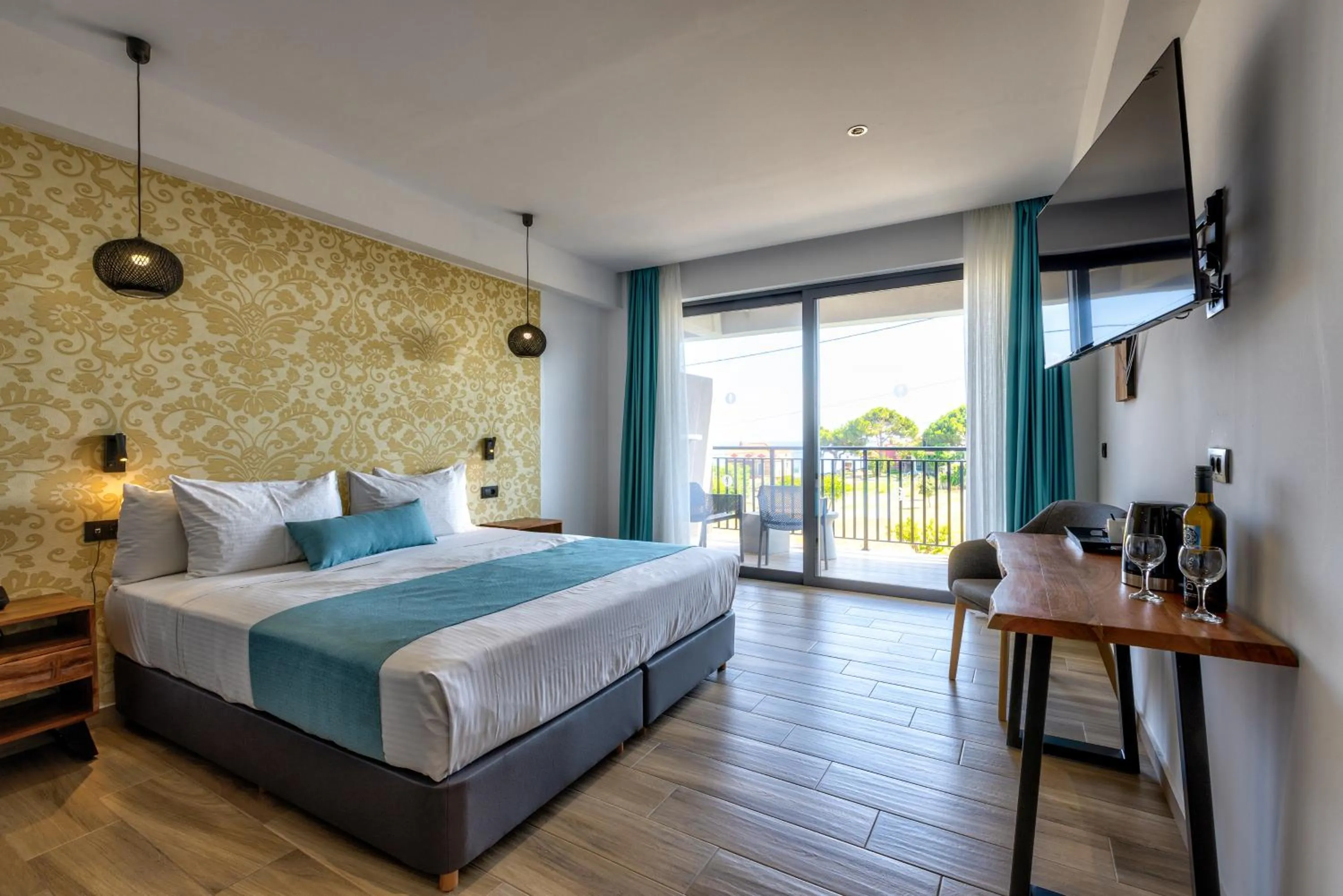 Bed in Cavo Orient Beach Hotel & Suites