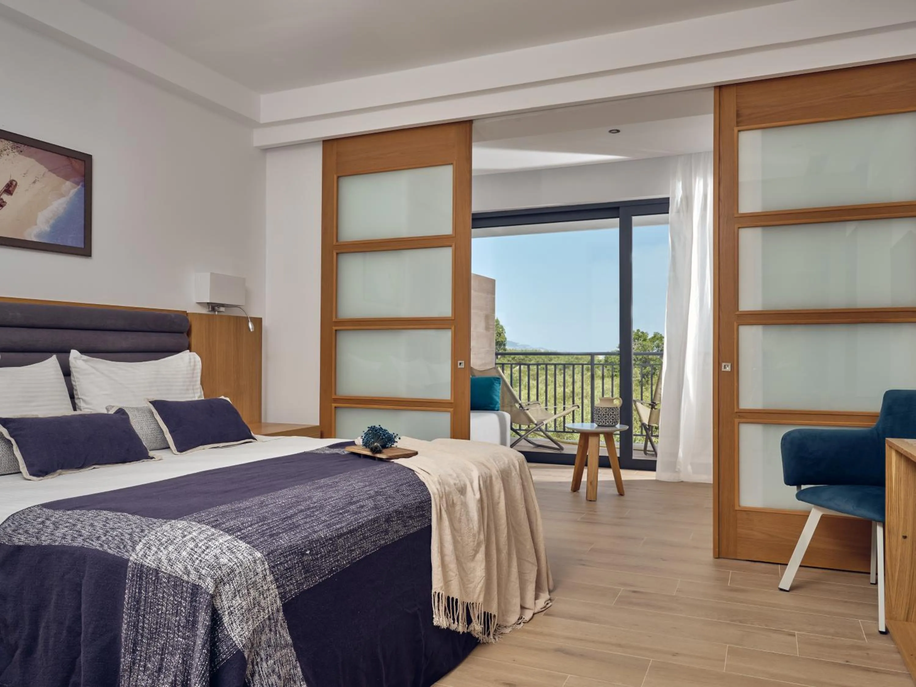 Photo of the whole room, Bed in Cavo Orient Beach Hotel & Suites