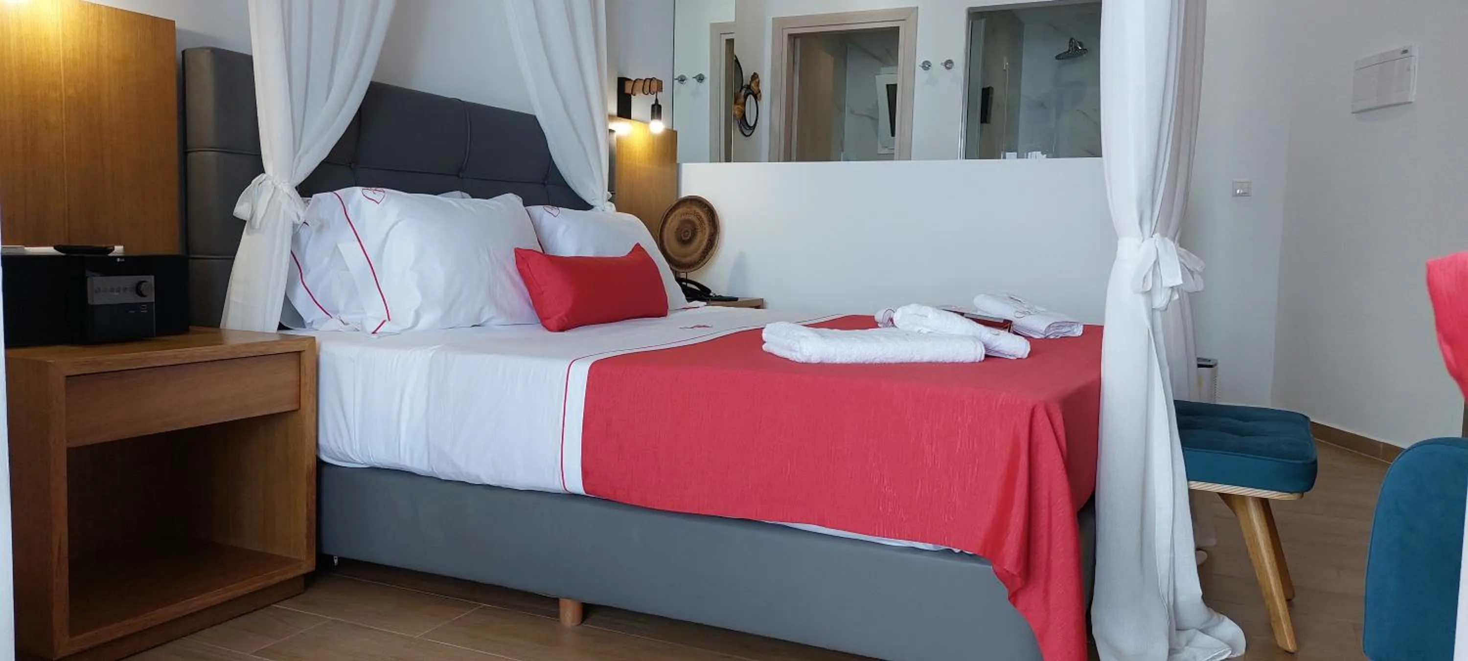 Bedroom, Bed in Cavo Orient Beach Hotel & Suites