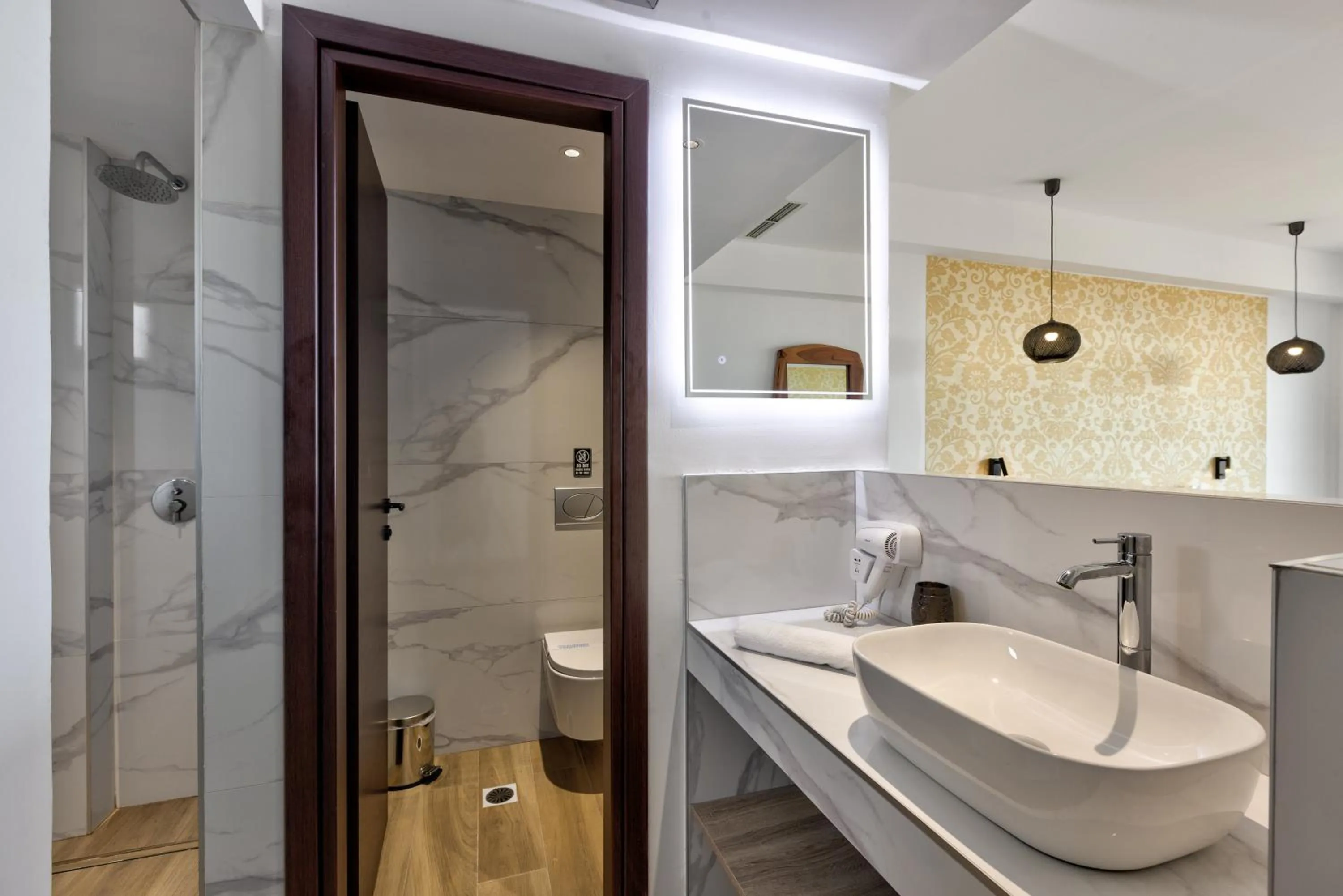 Shower in Cavo Orient Beach Hotel & Suites