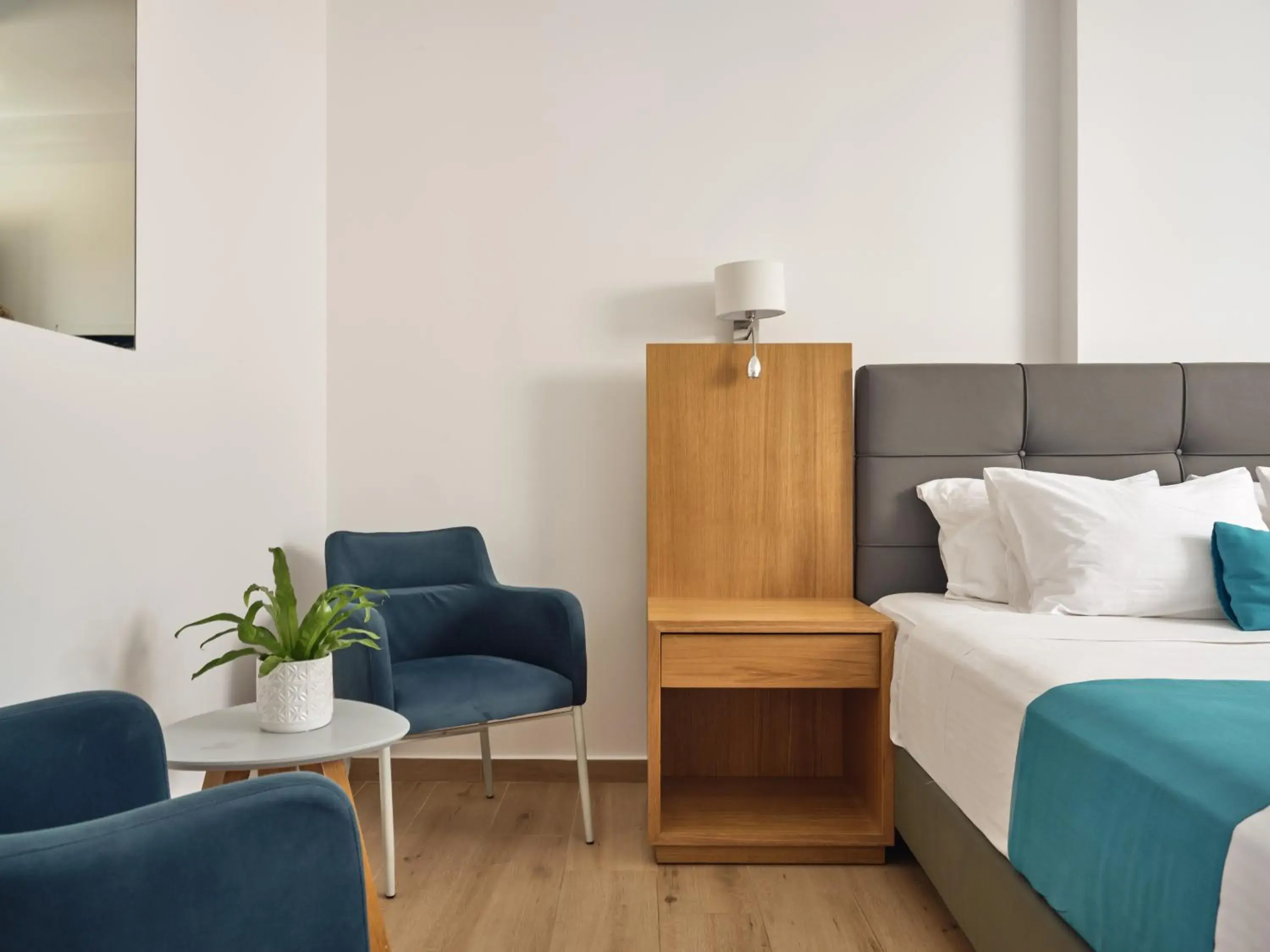 Seating area, Bed in Cavo Orient Beach Hotel & Suites Seating area, Bed in Cavo Orient Beach Hotel & Suites