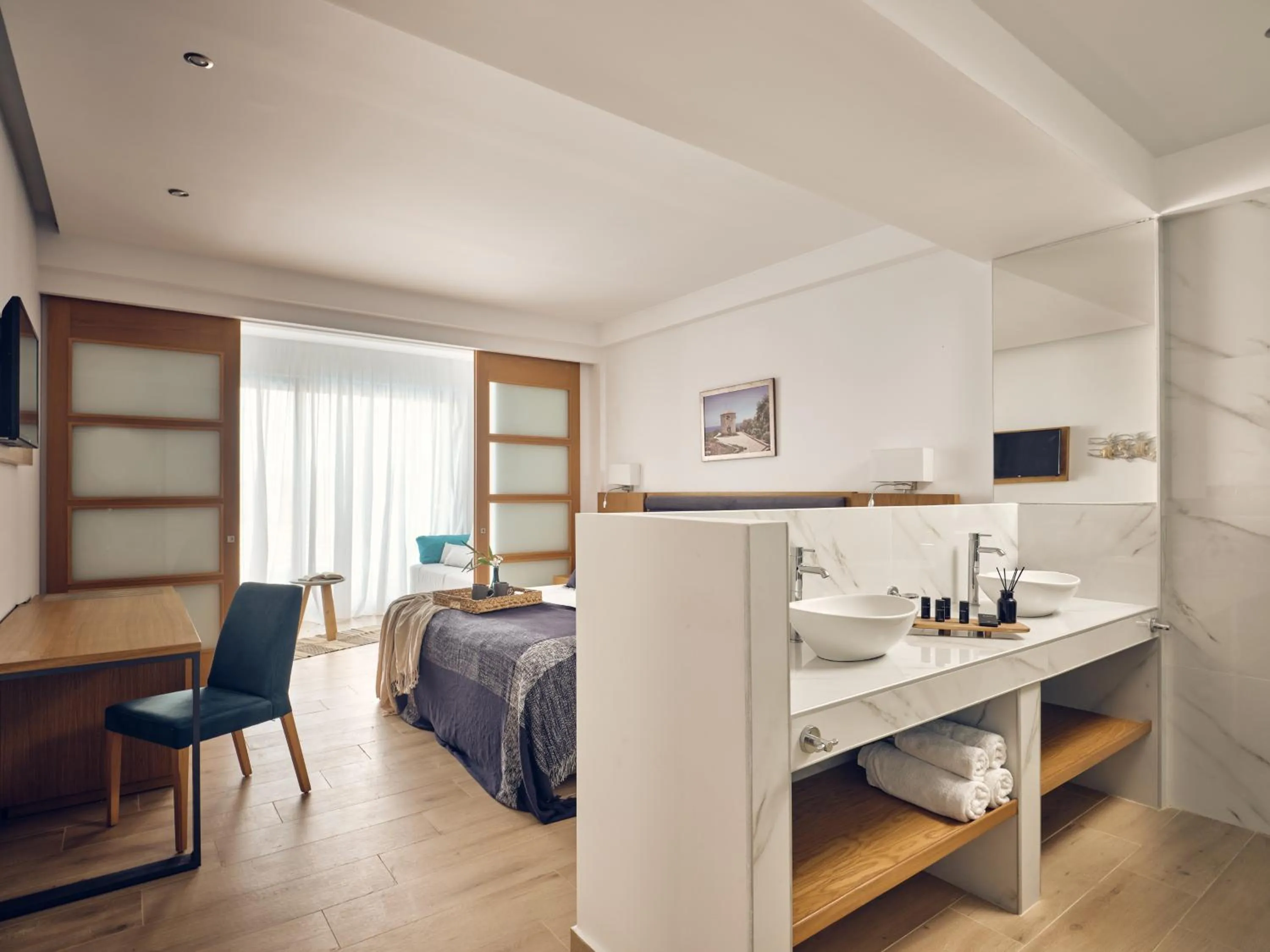 Bedroom, Bed in Cavo Orient Beach Hotel & Suites