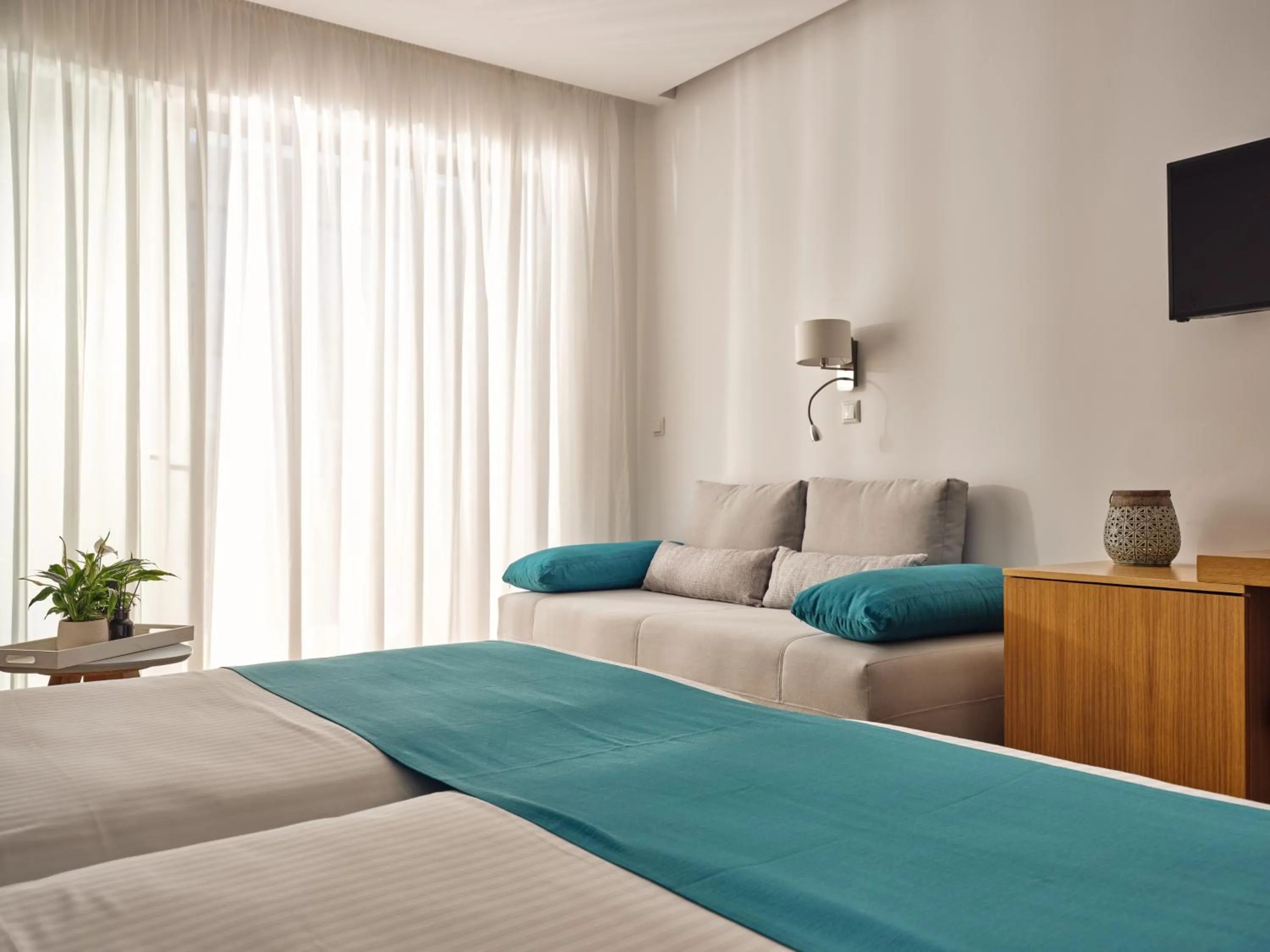 Bedroom, Bed in Cavo Orient Beach Hotel & Suites