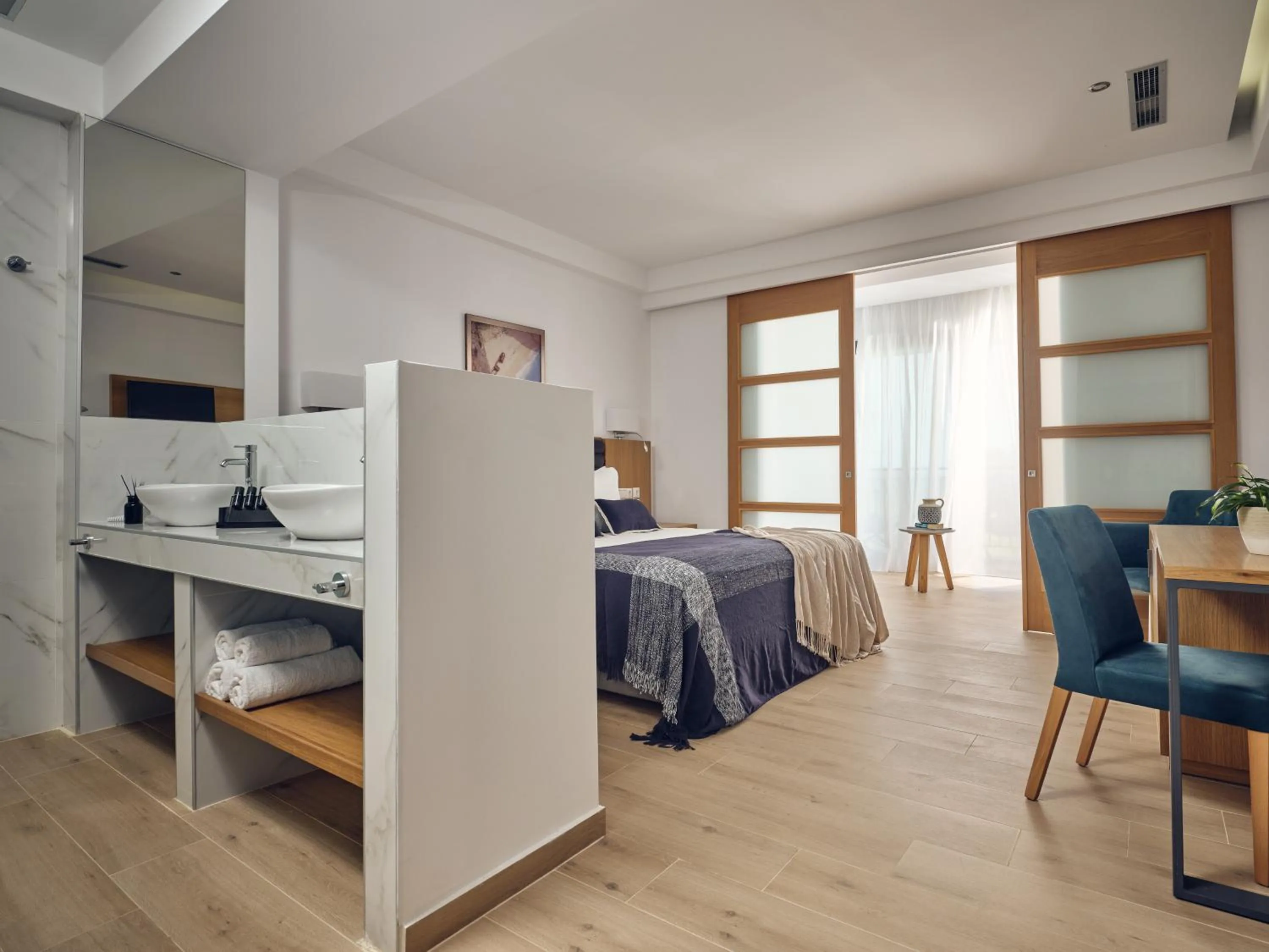 Photo of the whole room, Bed in Cavo Orient Beach Hotel & Suites