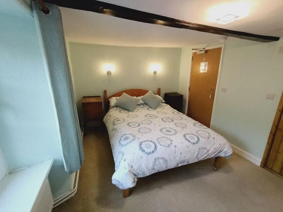 Bed in The Harp Inn