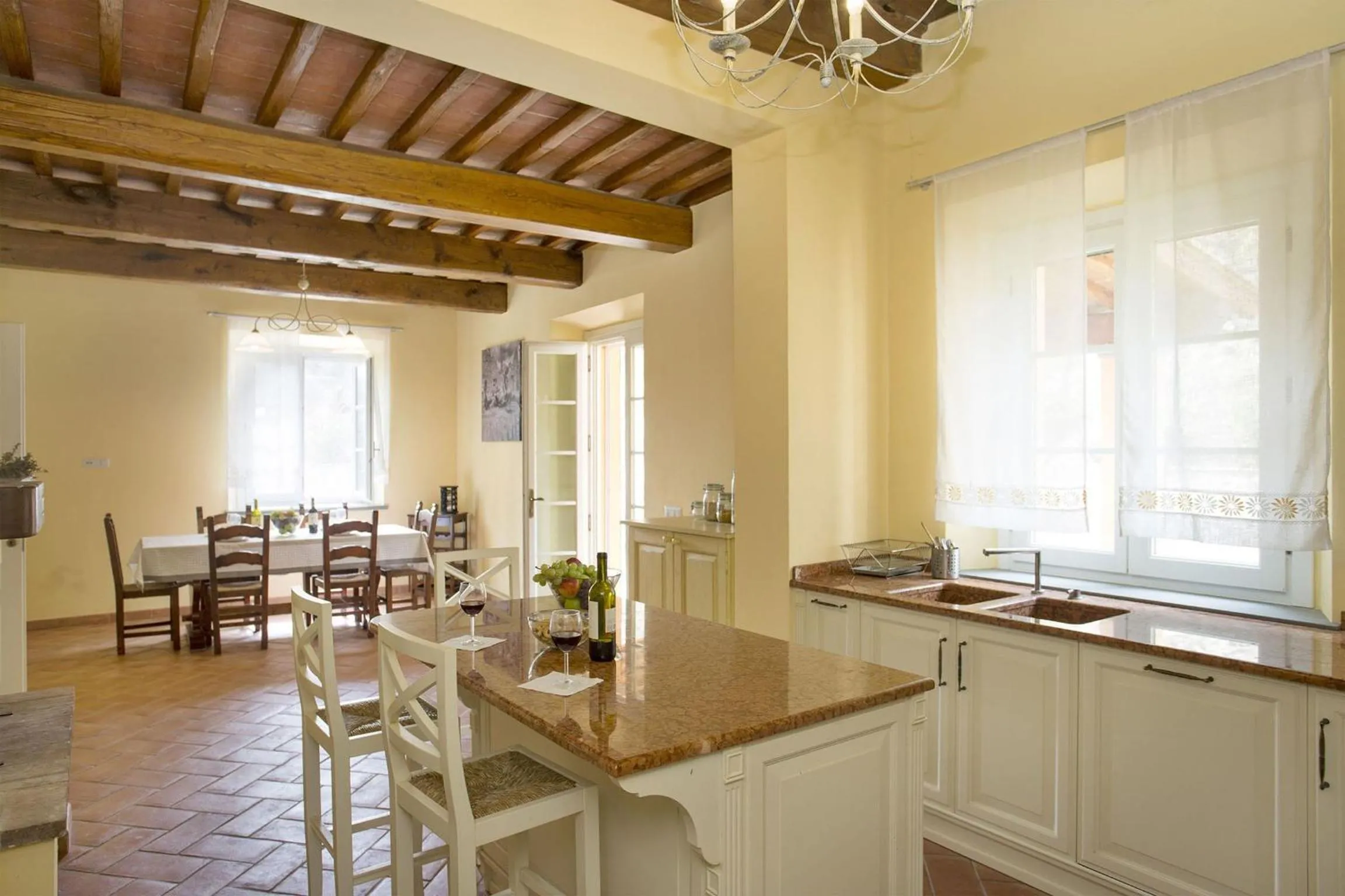 Kitchen or kitchenette in Santo Stefano 10 by Salogi Villas