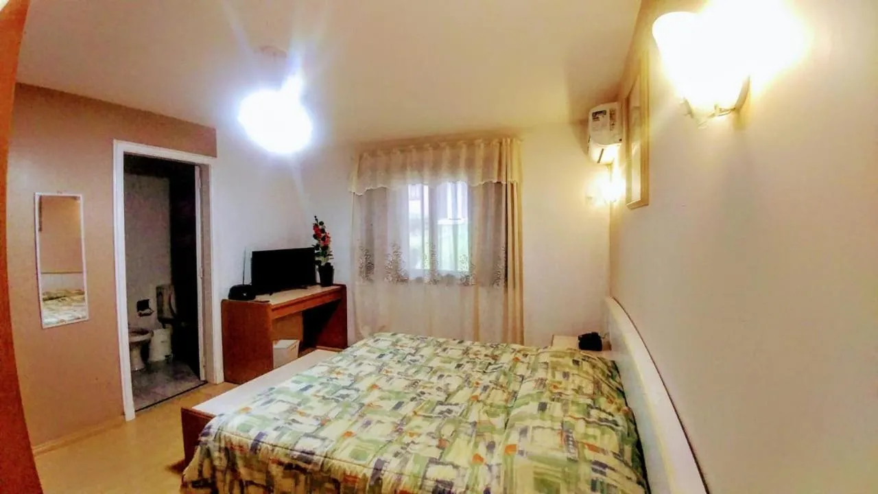 Bed in Pousada Gardenia Guest House