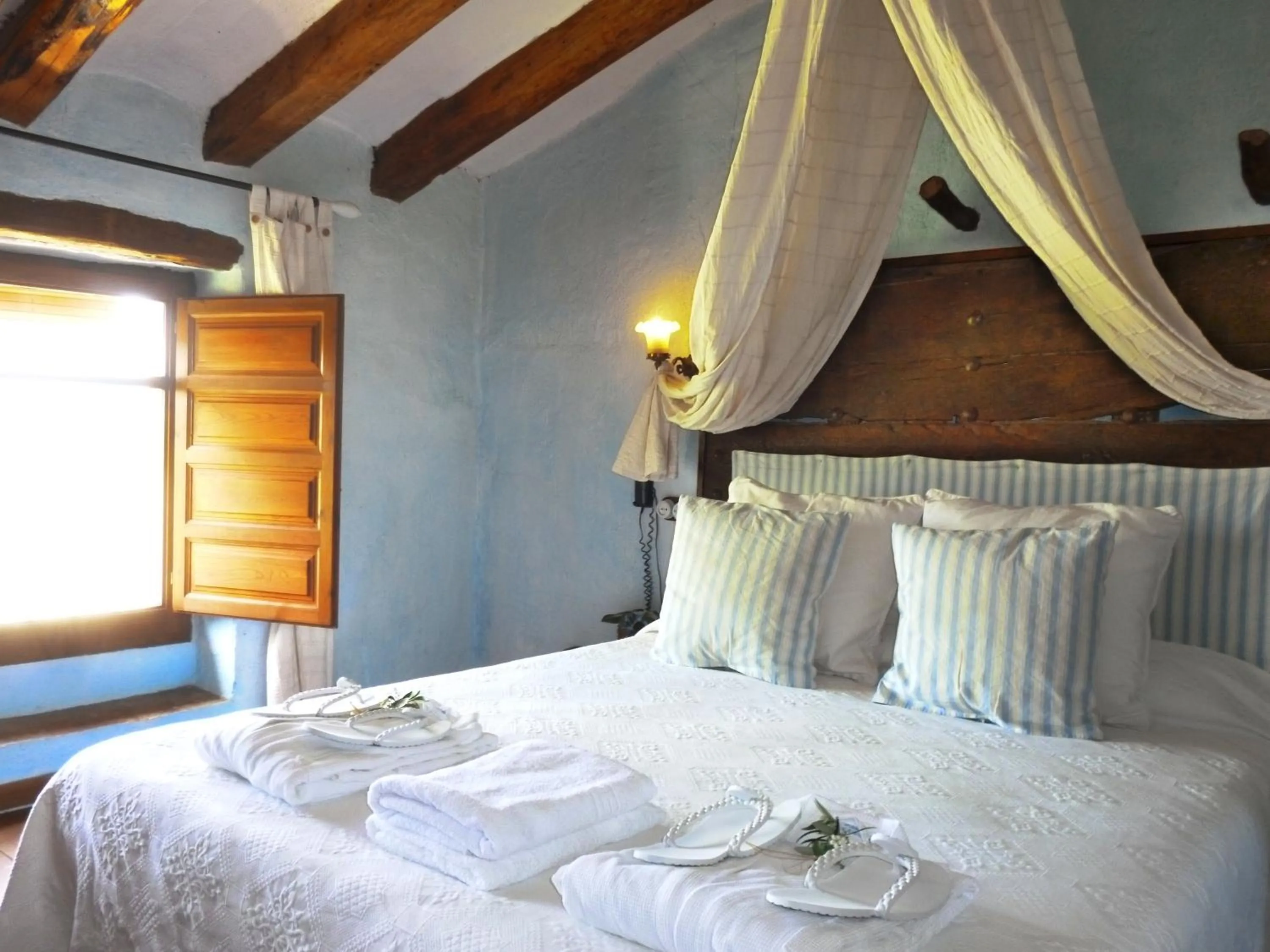 Bed in Les Vinyes Alojamiento Rural Boutique & SPA