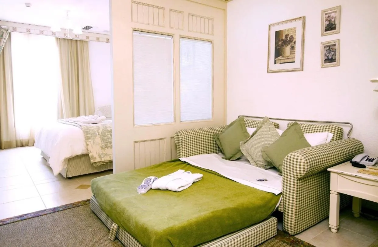 Bed in Il Campanario Villagio Resort Apto Studio 2111