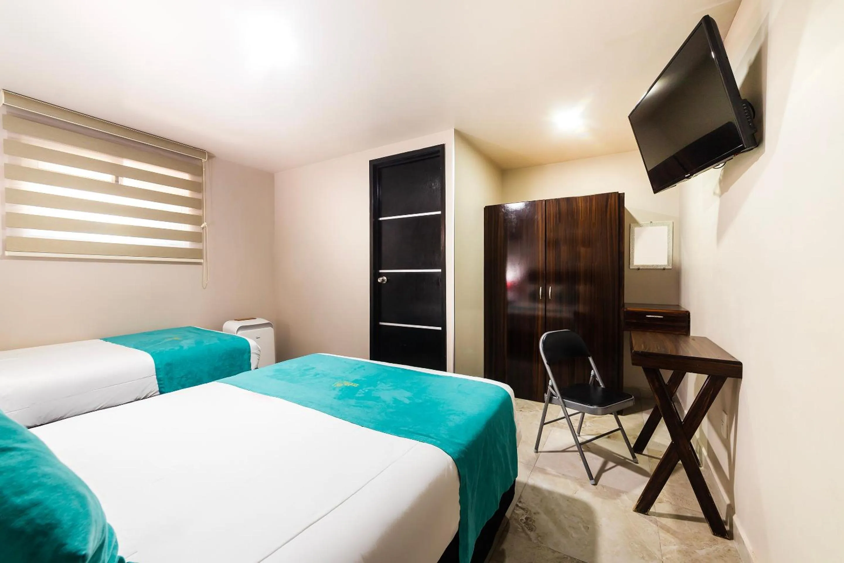 Bedroom in OYO Hotel Boutique Las Campanas