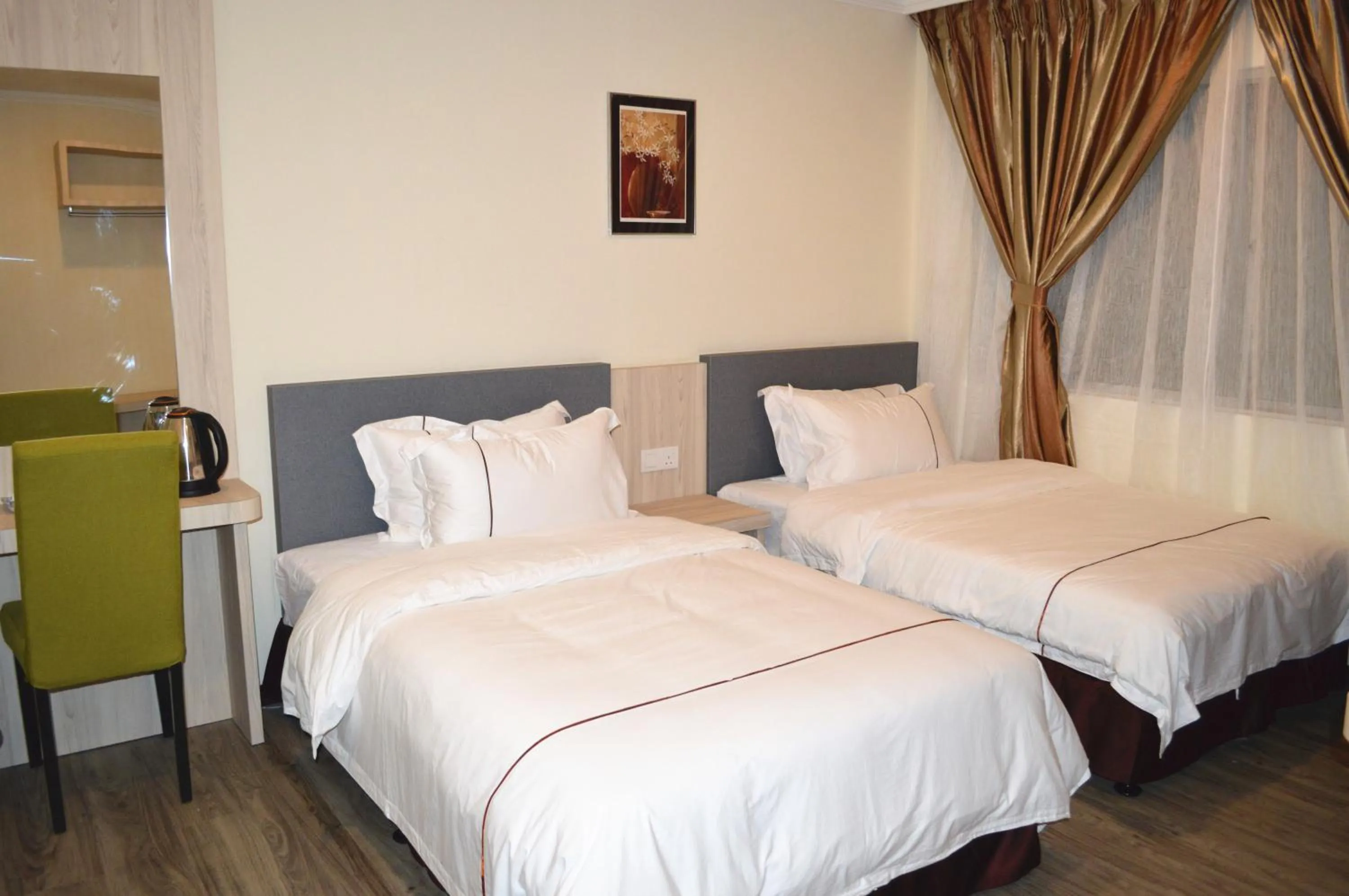 Bed in Angsoka Hotel