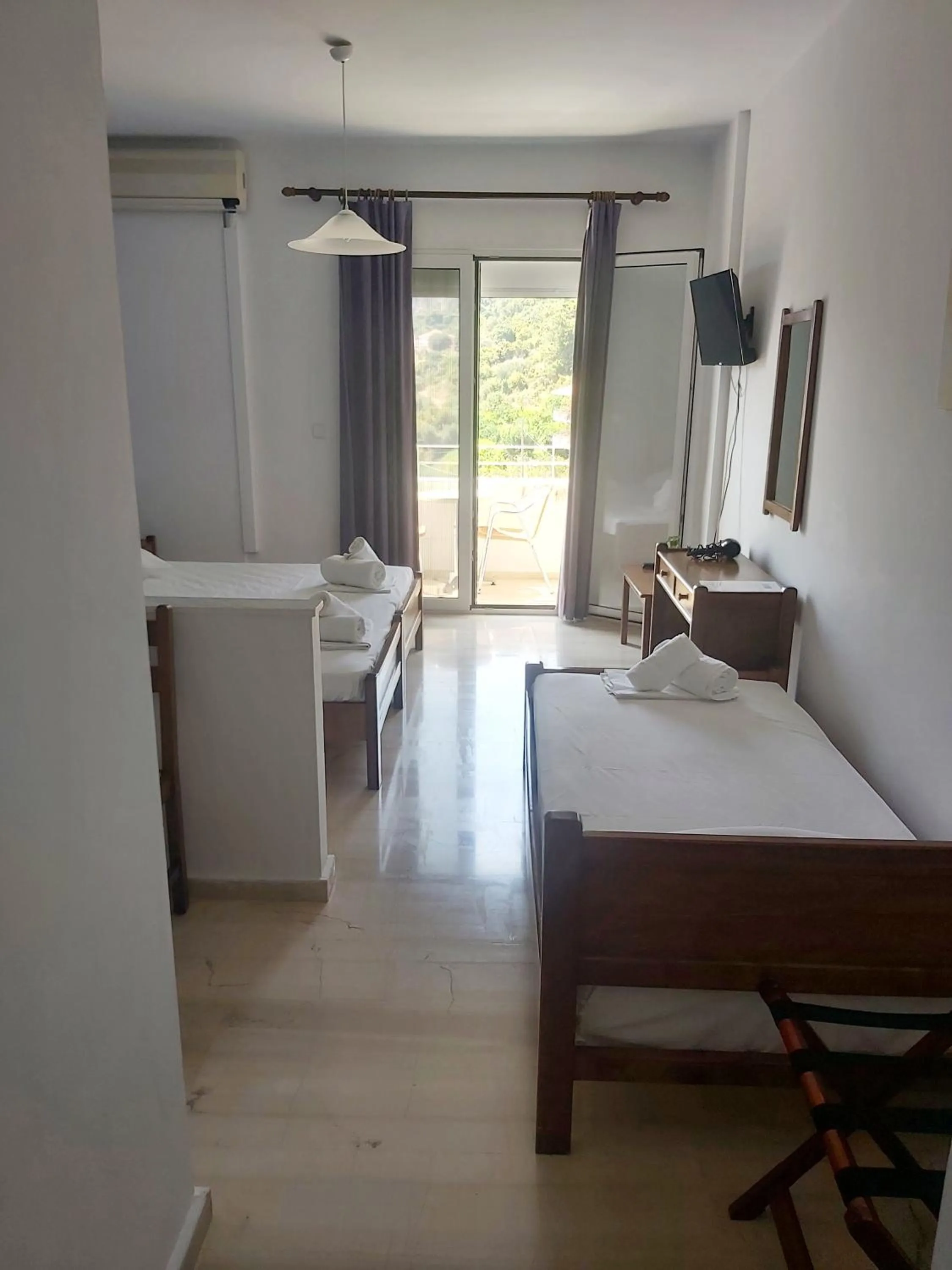 Bed in Filoxenia Hotel & Apartments