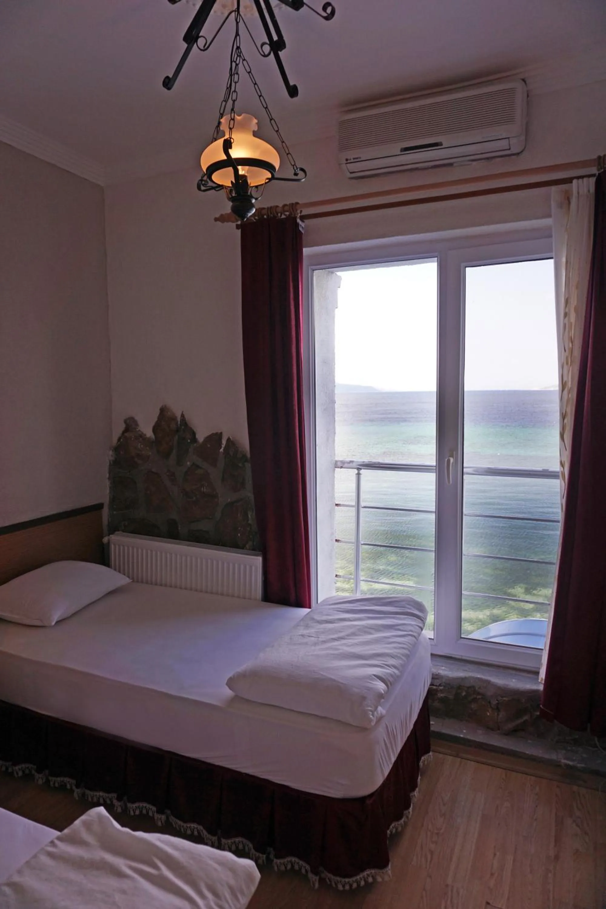 Seating area, Bed in Aqua Boss Hotel