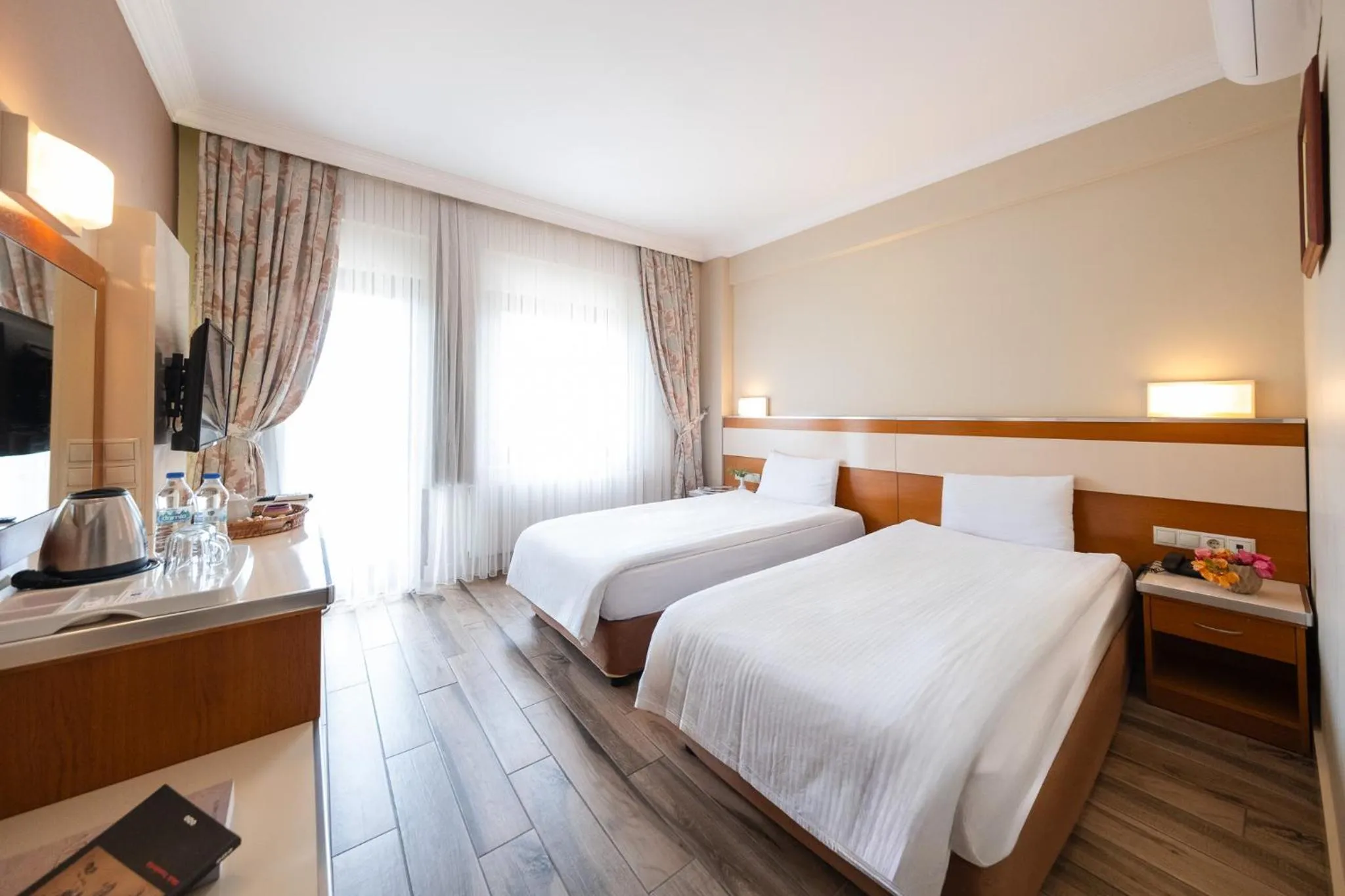 Bed in Iris Hotel & Spa