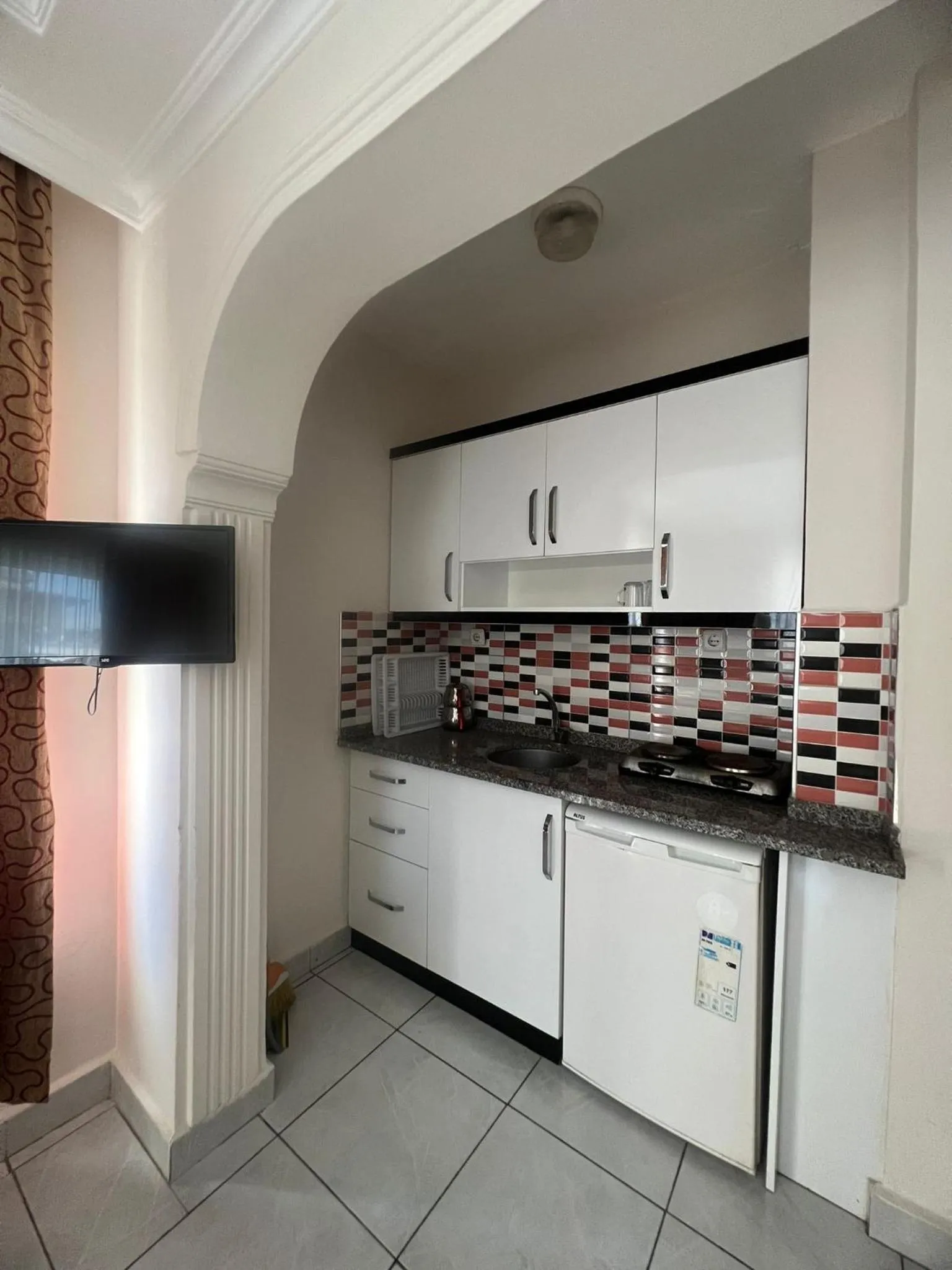 Kitchen or kitchenette in Safran Apart Hotel