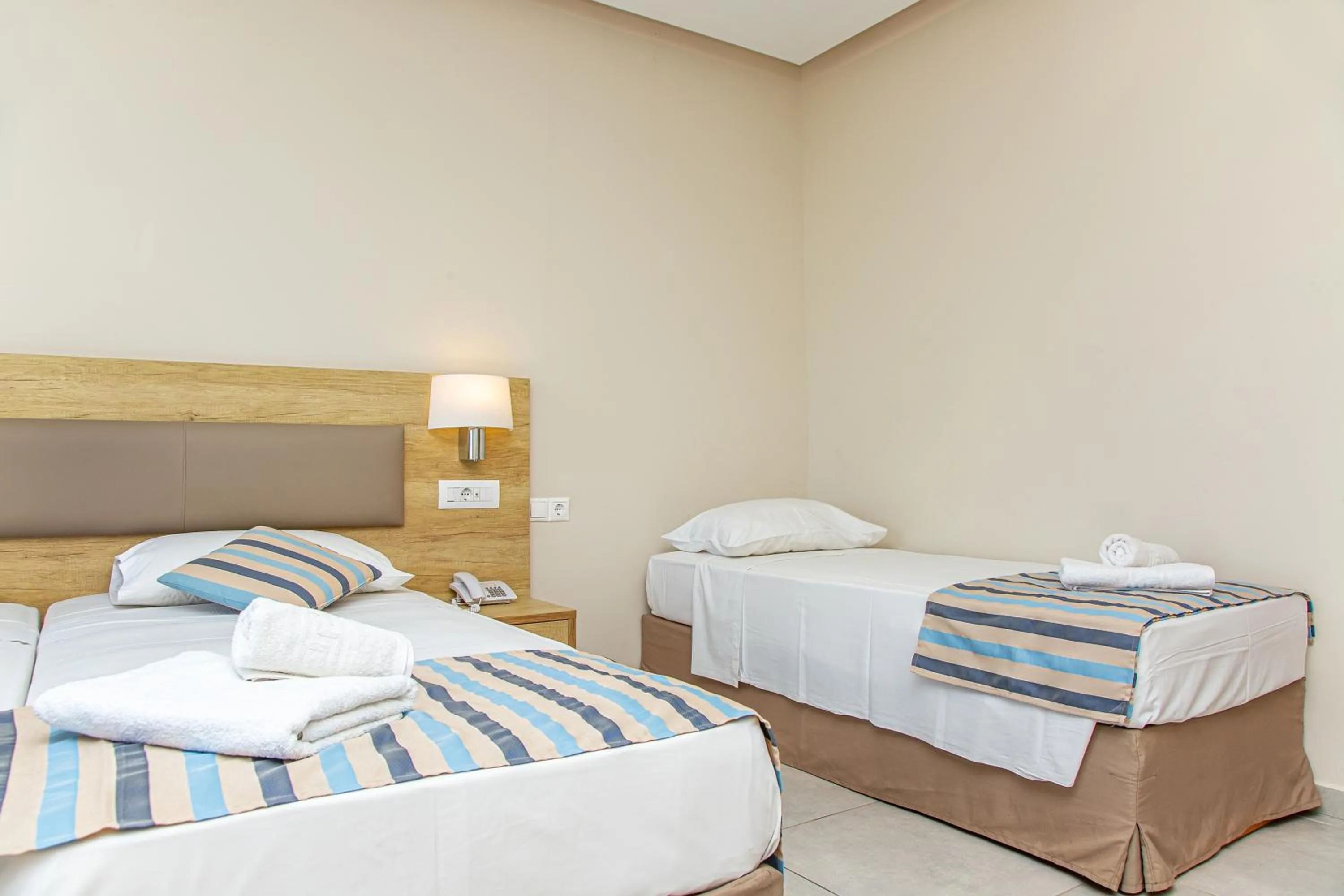 Bed in Theo Star Beach Hotel