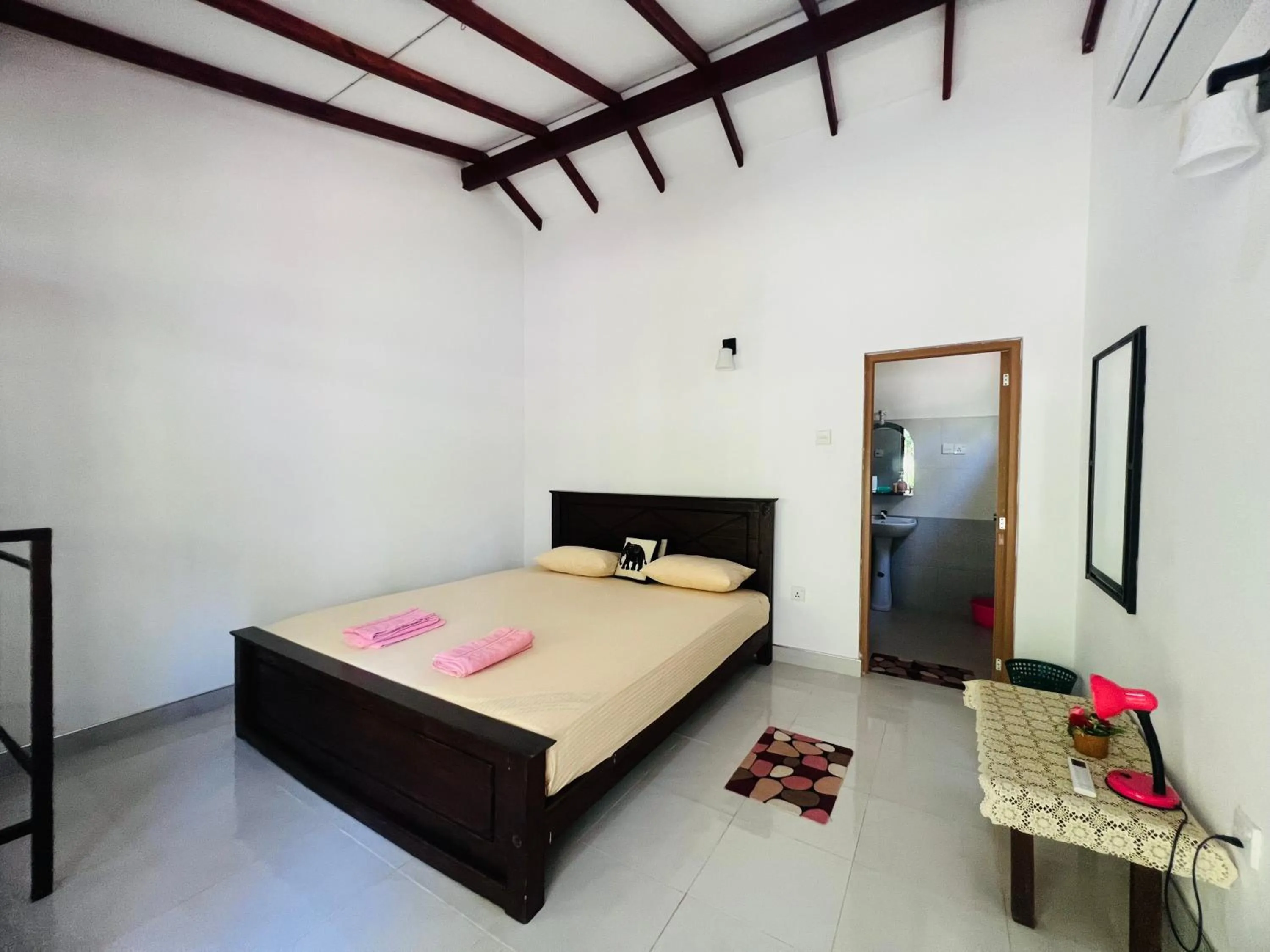 Photo of the whole room, Bed in Harini Villa