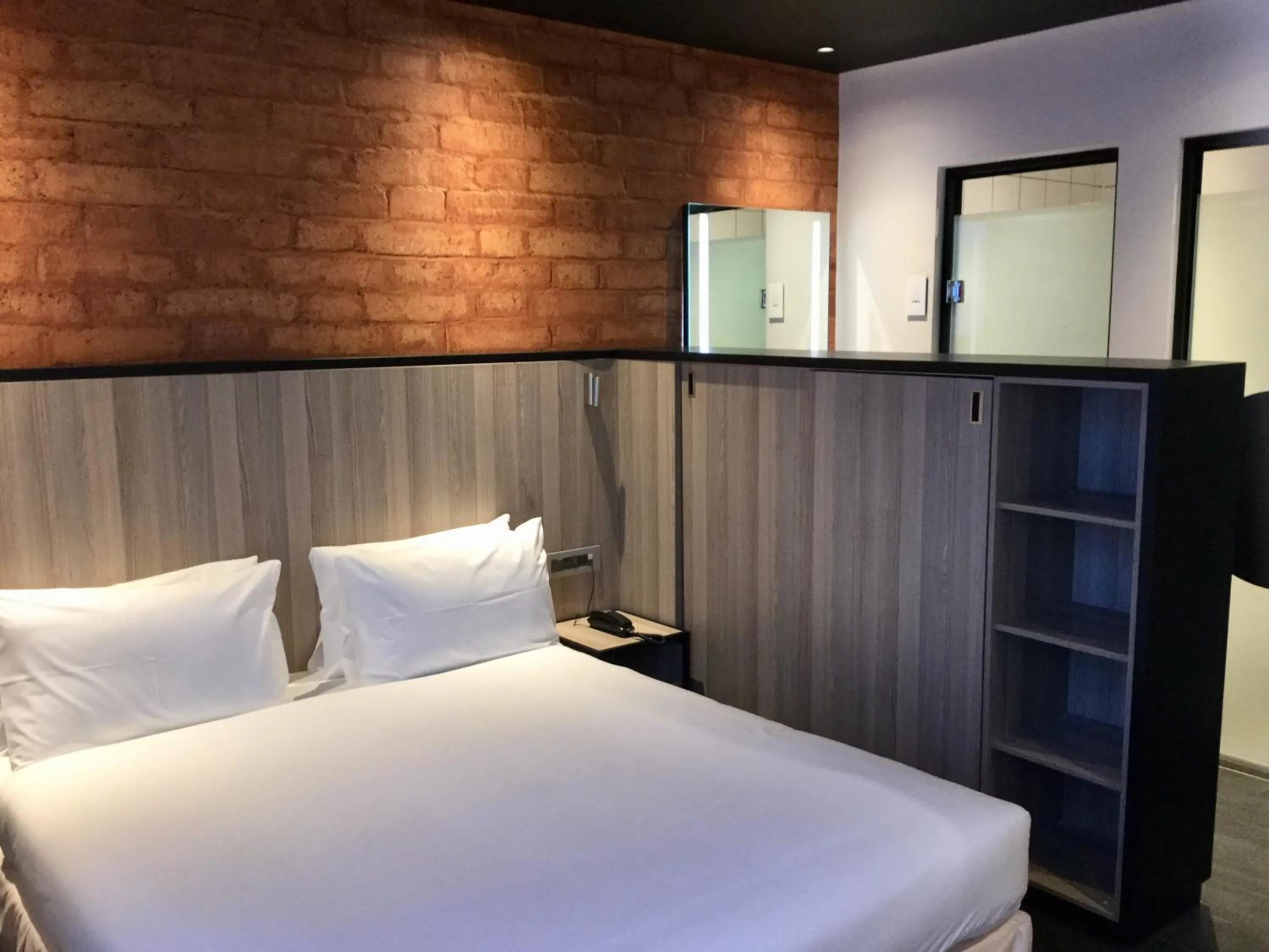 Photo of the whole room, Bed in Onomo Hotel Kigali