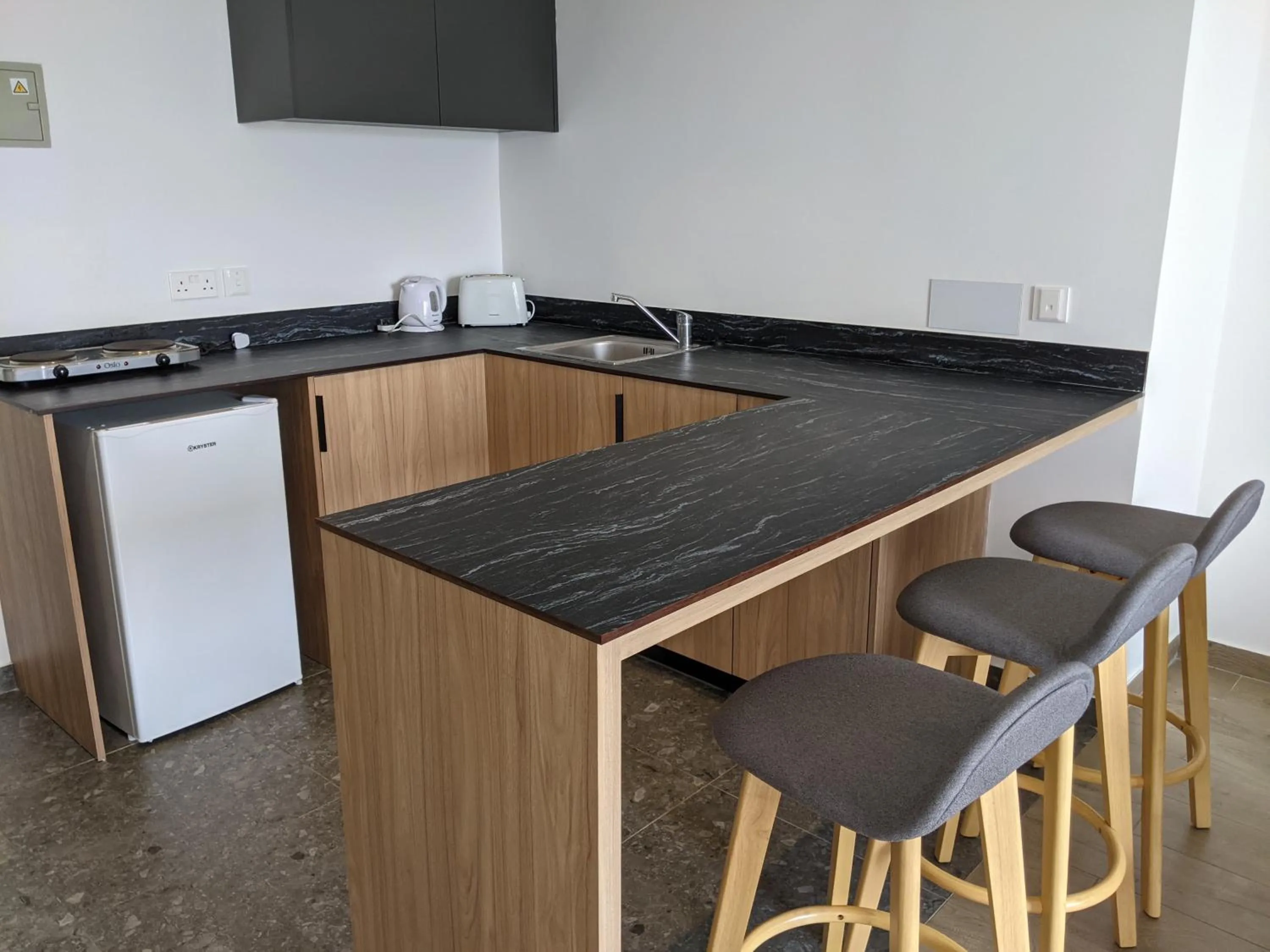 Kitchen or kitchenette in Sunflower Hotel Apartments