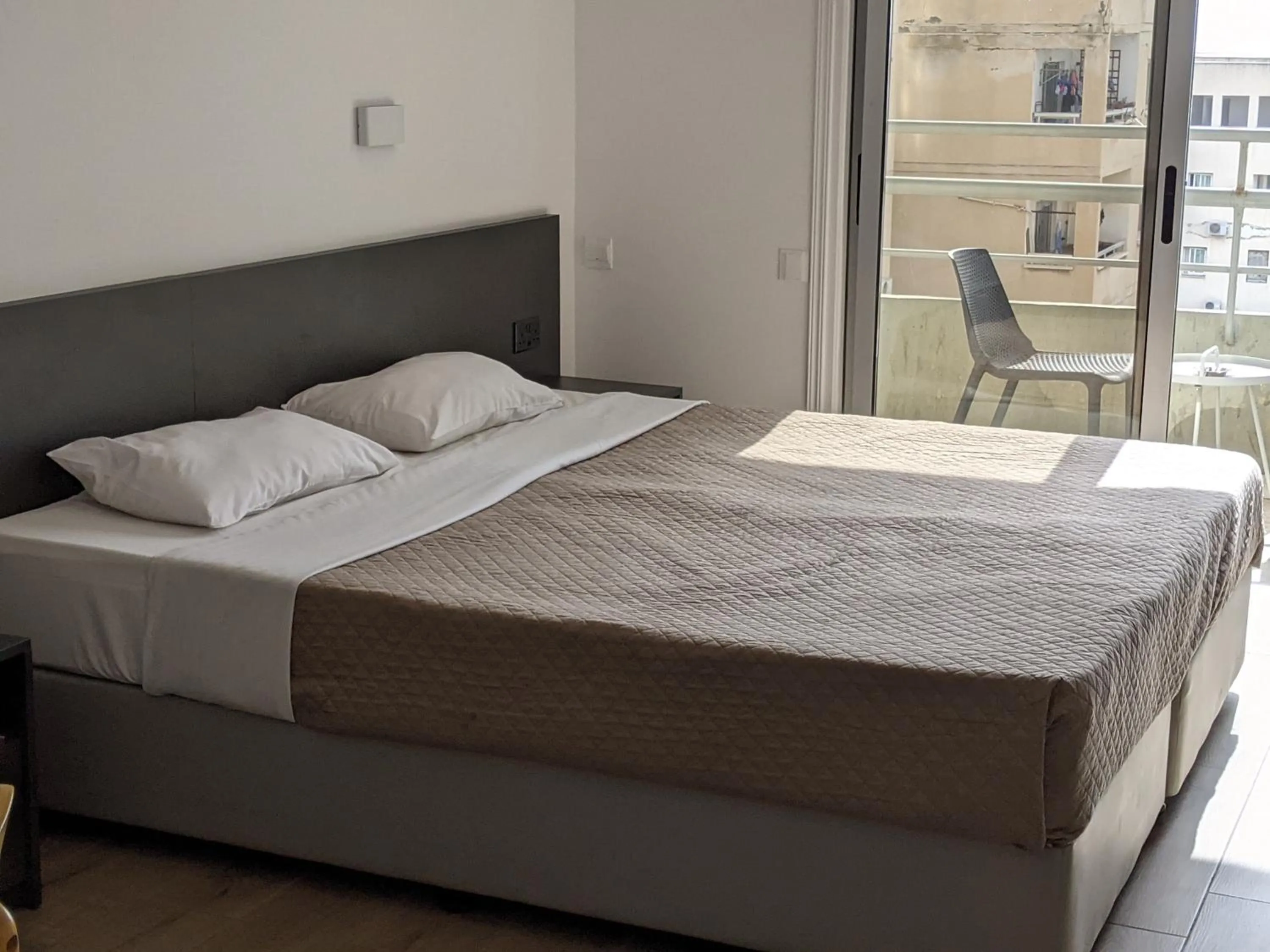 Bed in Sunflower Hotel Apartments