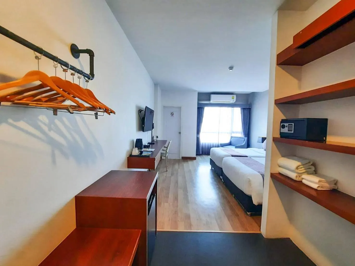 Photo of the whole room, Bed in Comet Hotel Surat Thani