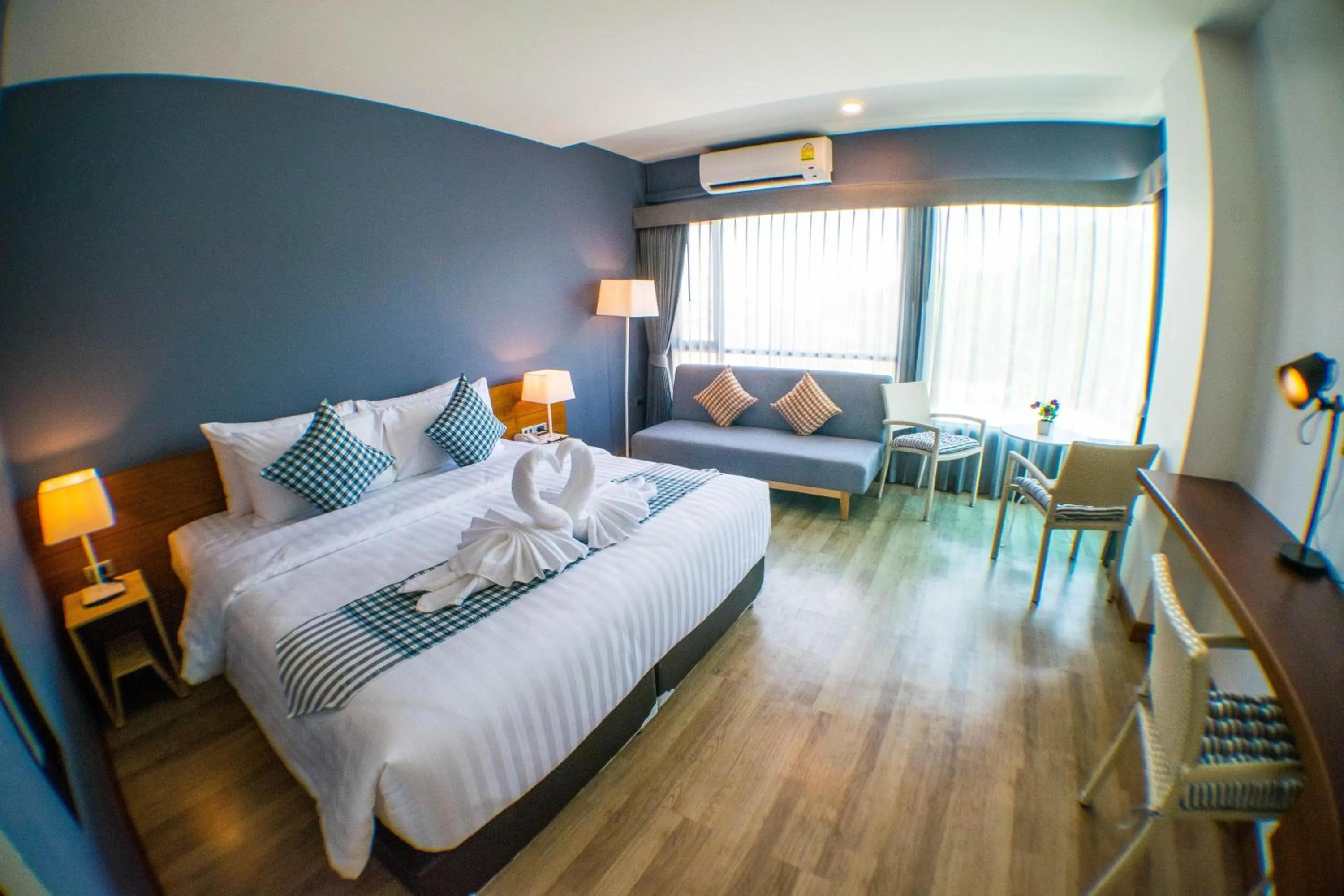 Photo of the whole room, Bed in Comet Hotel Surat Thani