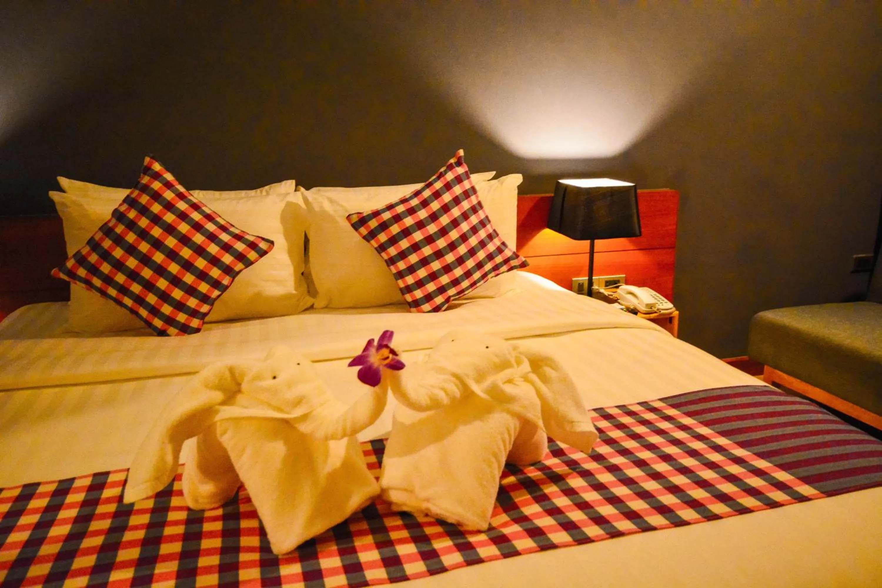 Photo of the whole room, Bed in Comet Hotel Surat Thani