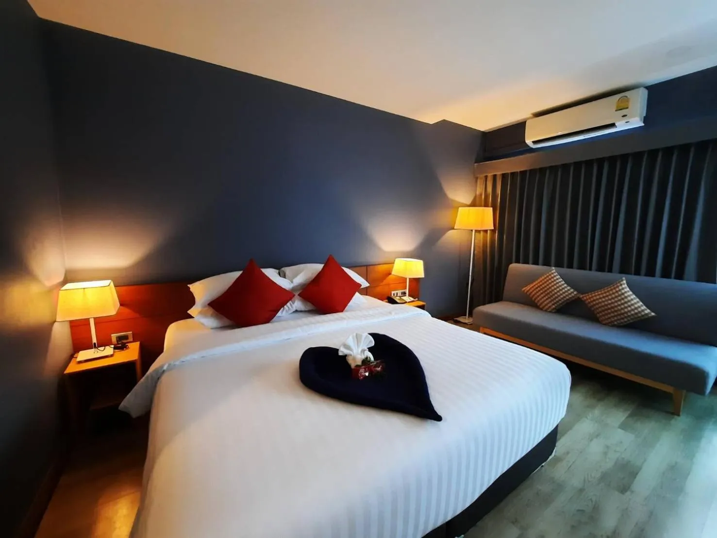 Photo of the whole room, Bed in Comet Hotel Surat Thani