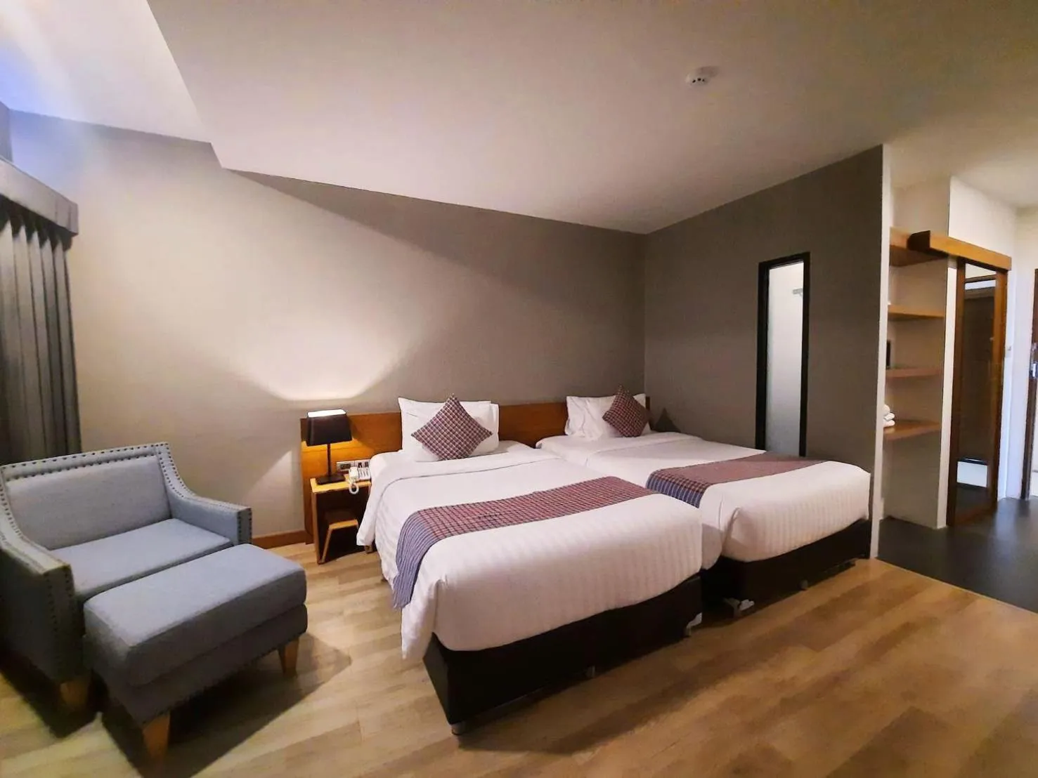 Photo of the whole room, Bed in Comet Hotel Surat Thani