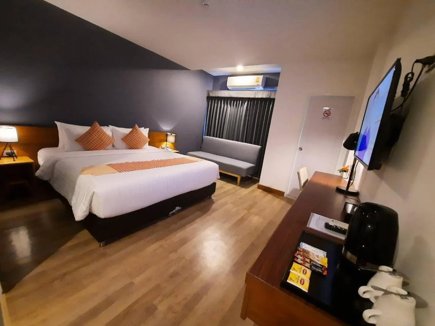 Photo of the whole room, Bed in Comet Hotel Surat Thani