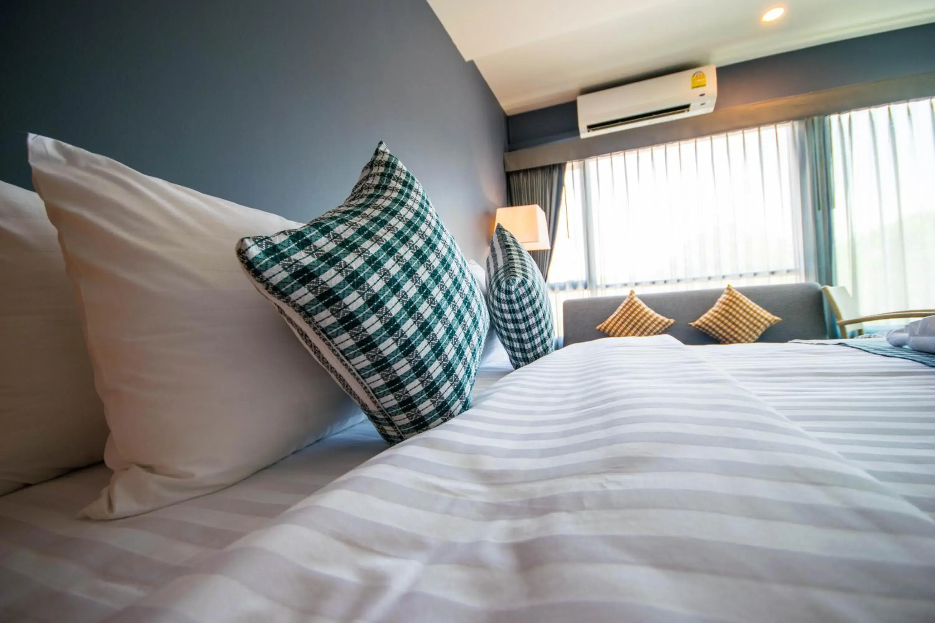 Photo of the whole room, Bed in Comet Hotel Surat Thani Photo of the whole room, Bed in Comet Hotel Surat Thani