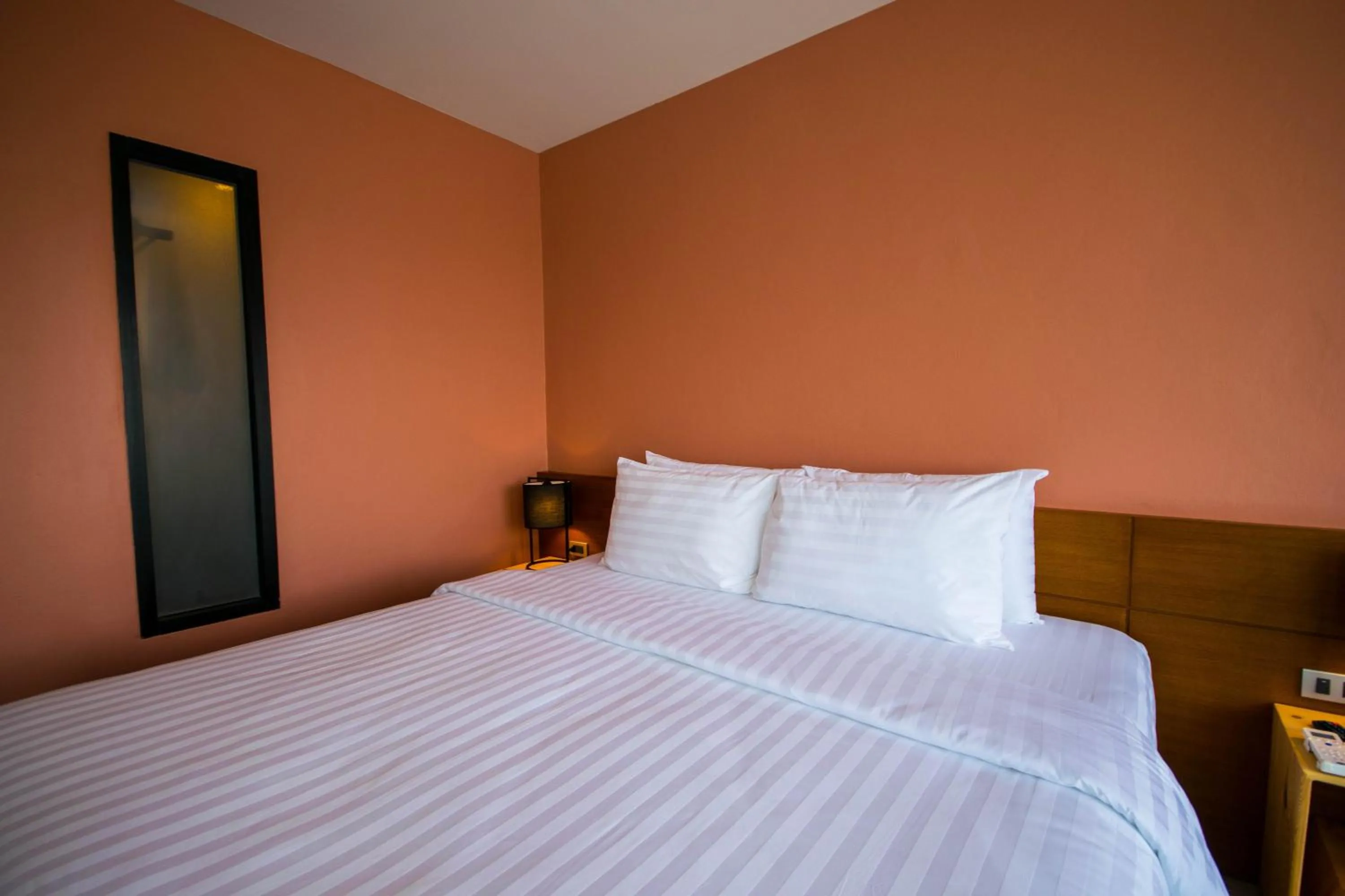 Photo of the whole room, Bed in Comet Hotel Surat Thani