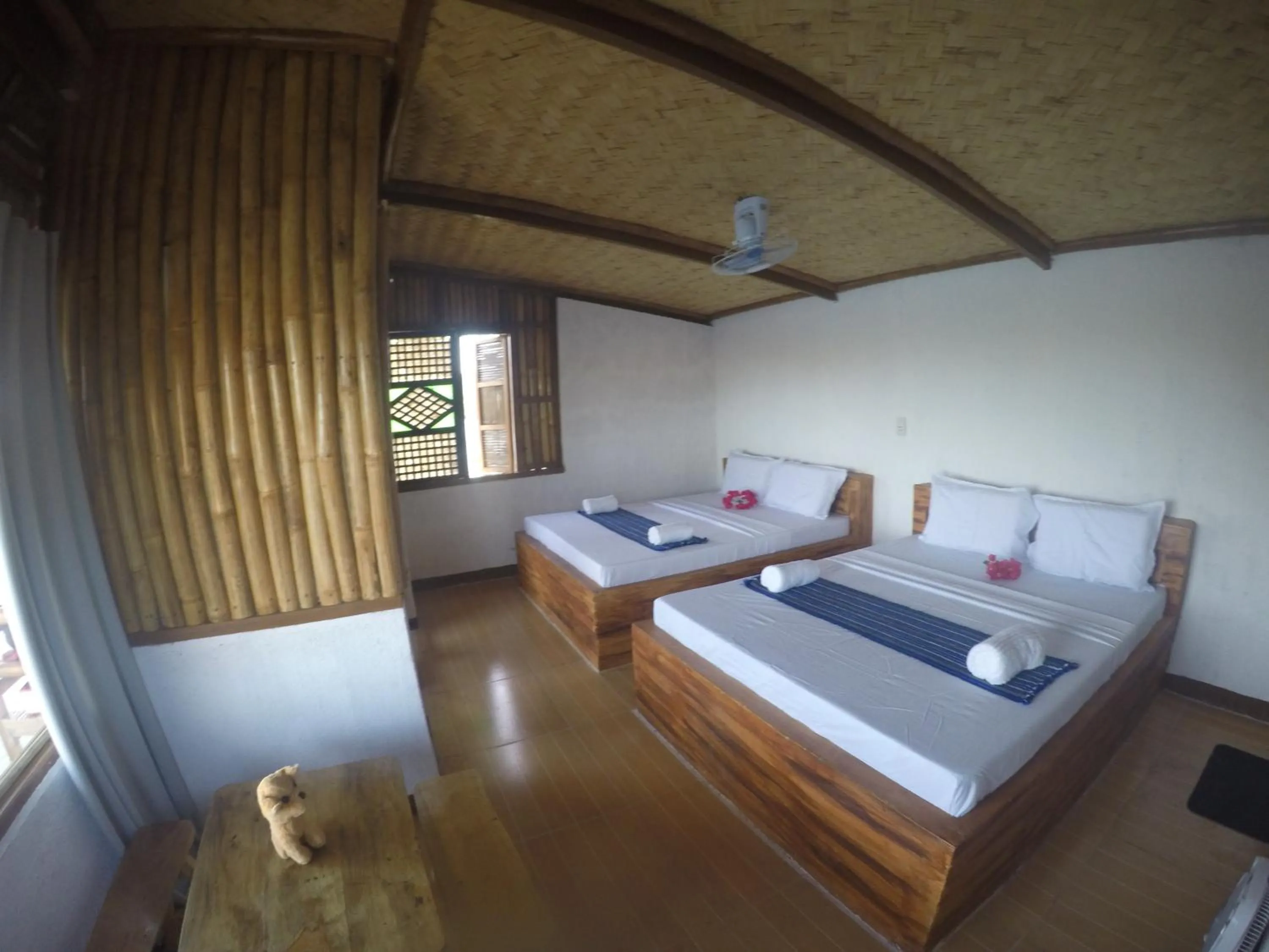 Bed in Borac Bay Bungalows Hotel and Resort