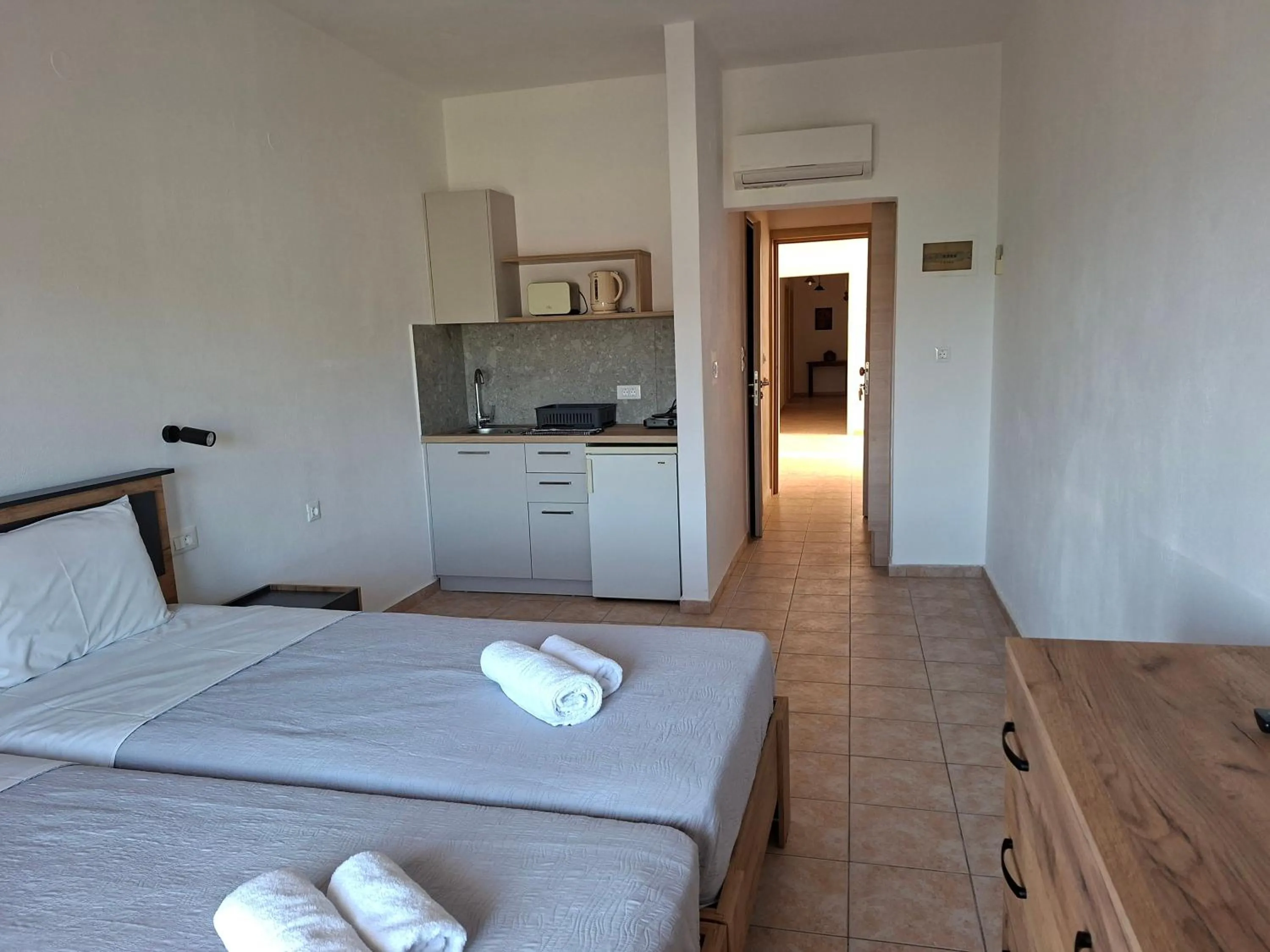 Bed in Corali Studios & Portobello Apartments