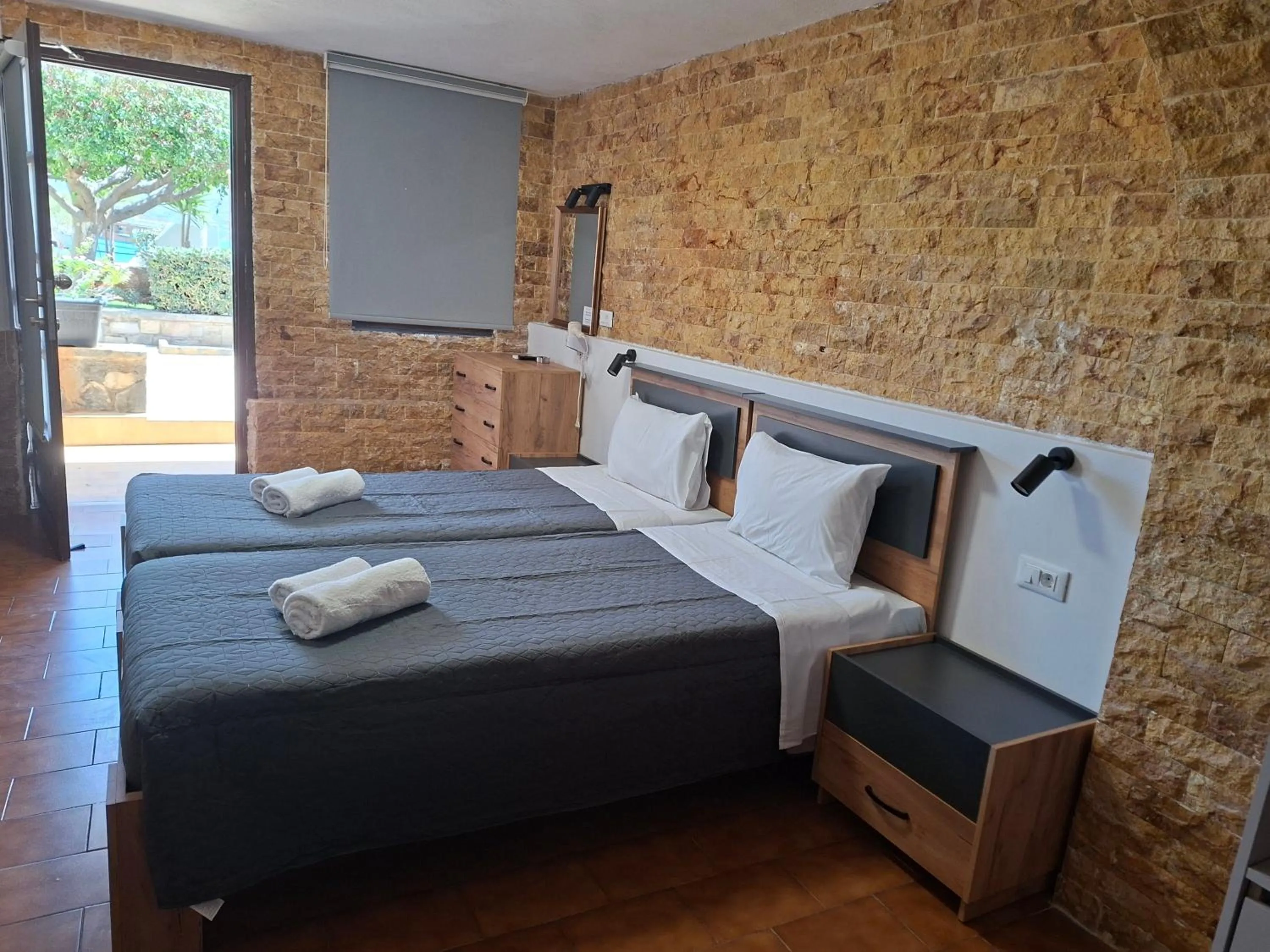 Bed in Corali Studios & Portobello Apartments