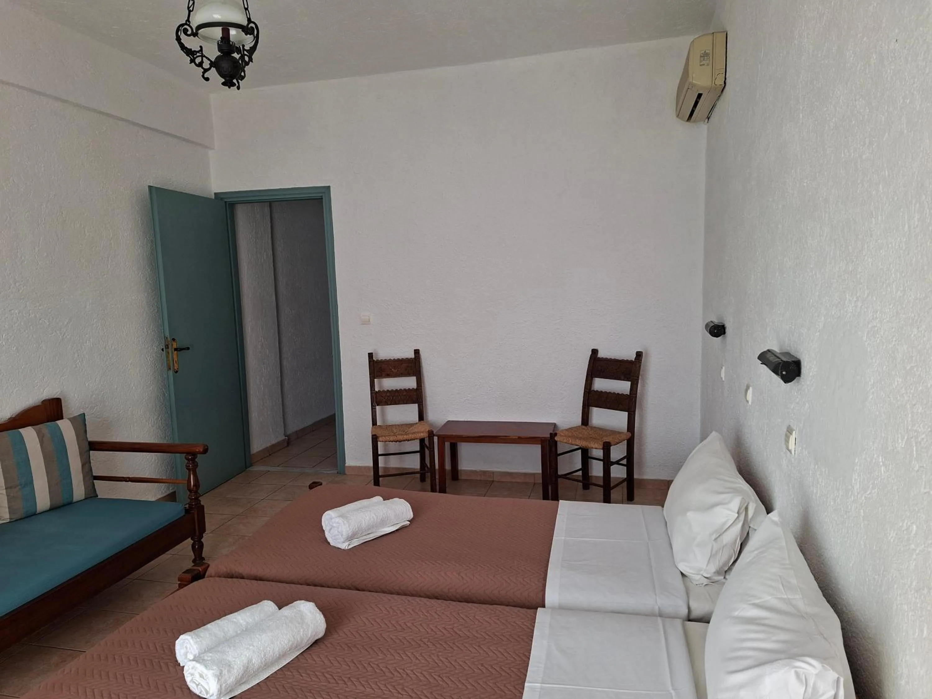 Bed in Corali Studios & Portobello Apartments