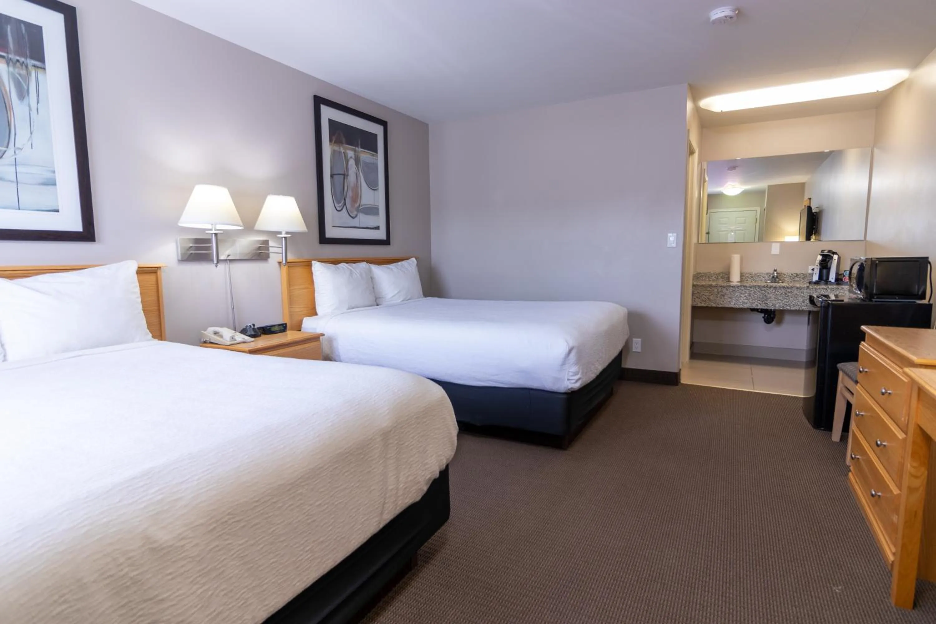 Bed in The Kanata by BCMInns - Hinton