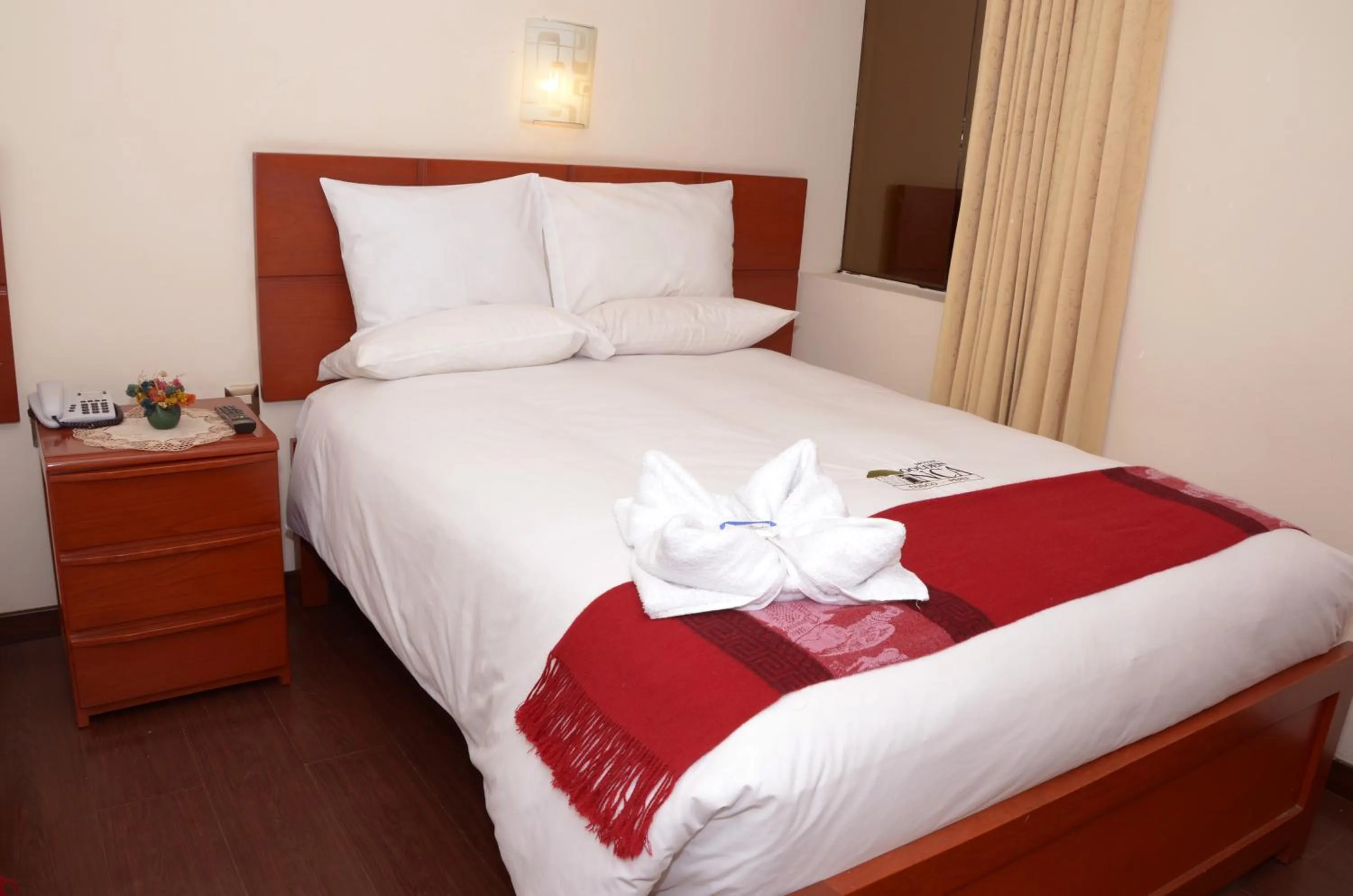 Bed in Golden Inca Hotel