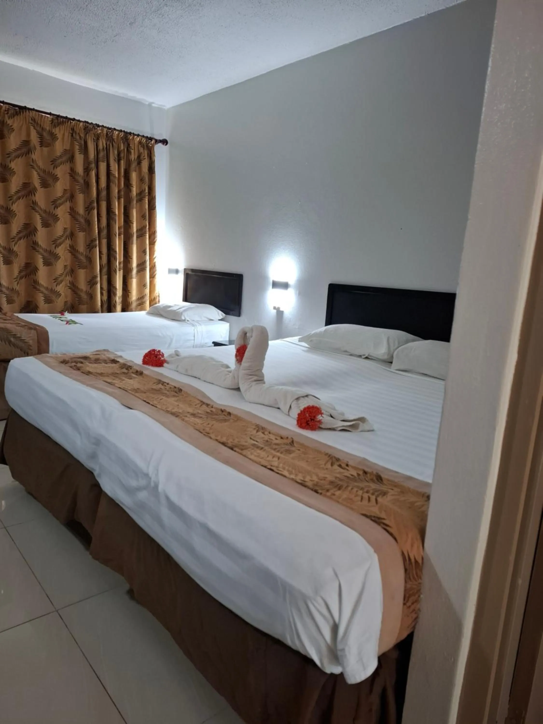 Bed in Capricorn International Hotel