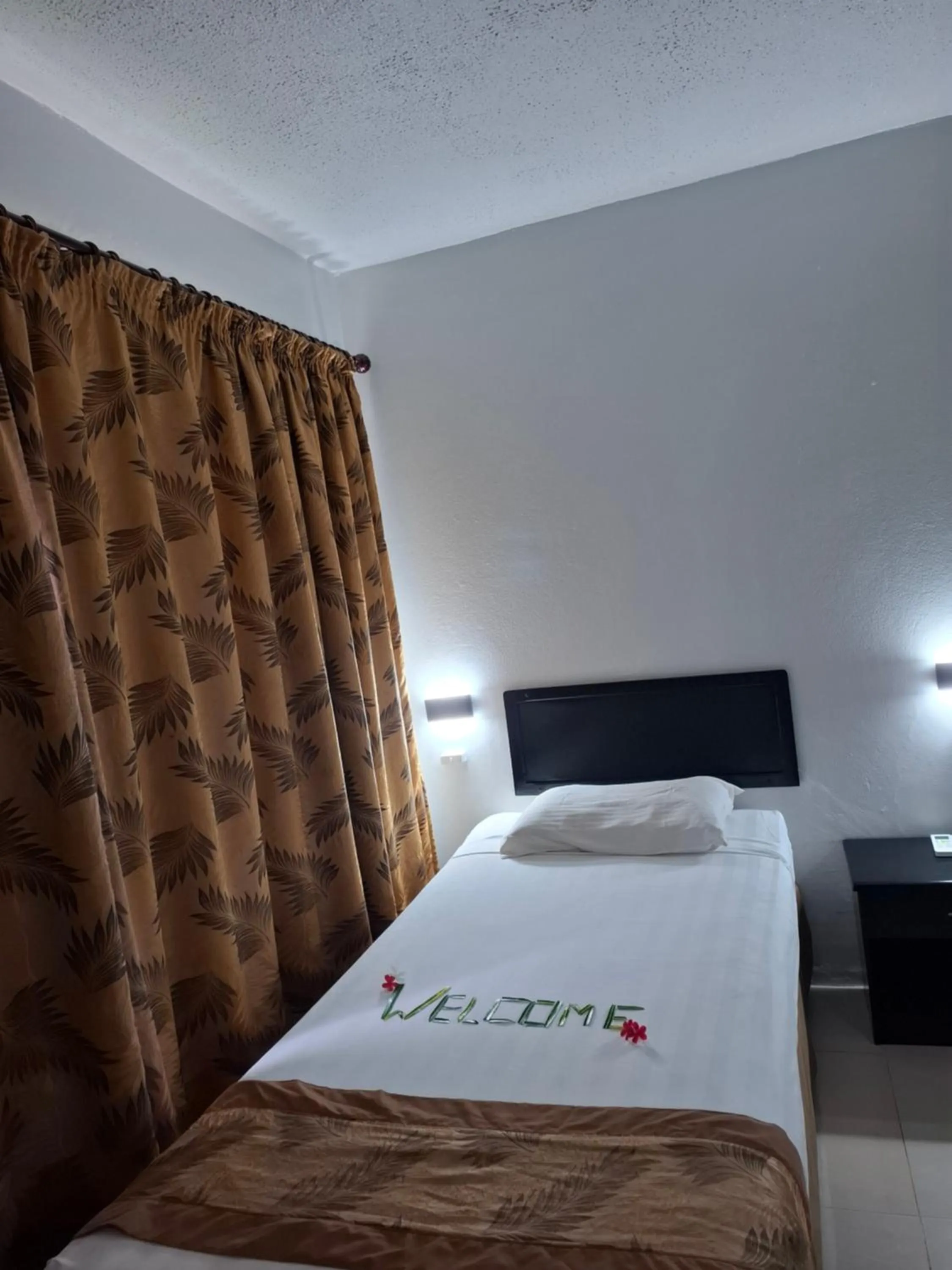 Bed in Capricorn International Hotel