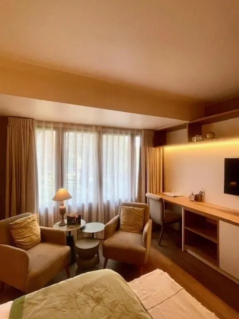 Bed in Charmehotel Manoir Ogygia