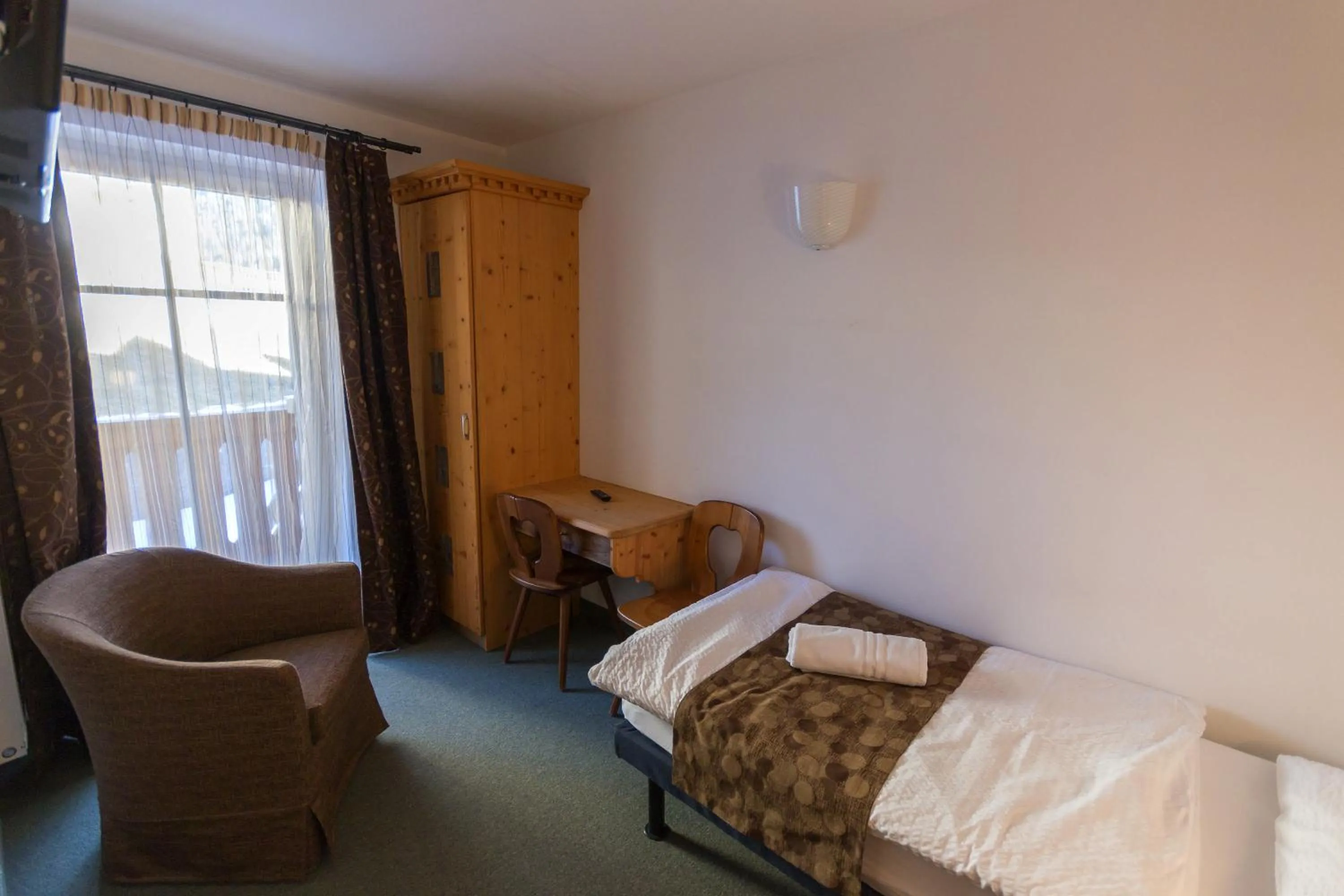 Bed in Arnica Mountain Hotel