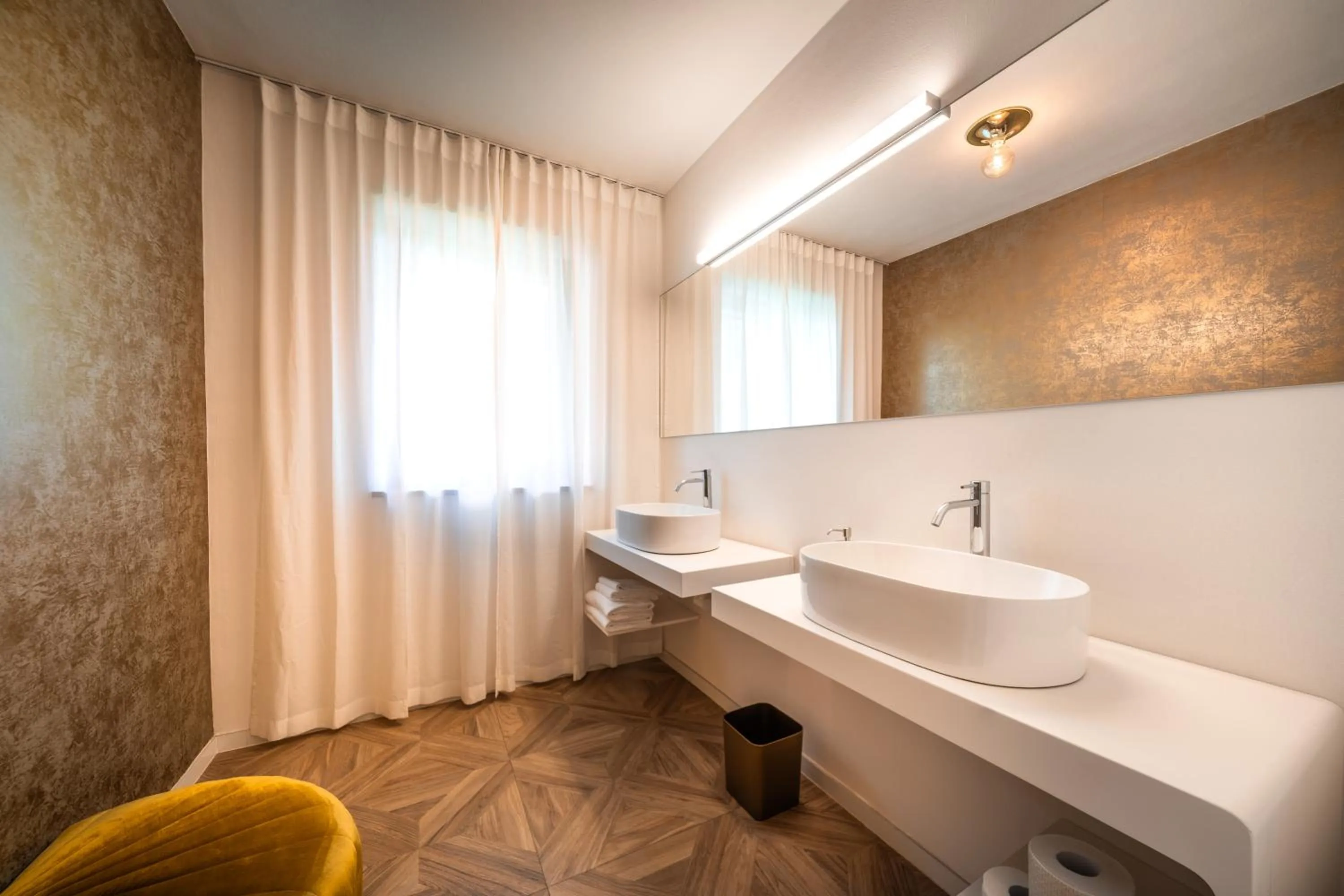 Bathroom in goldfinger + suites