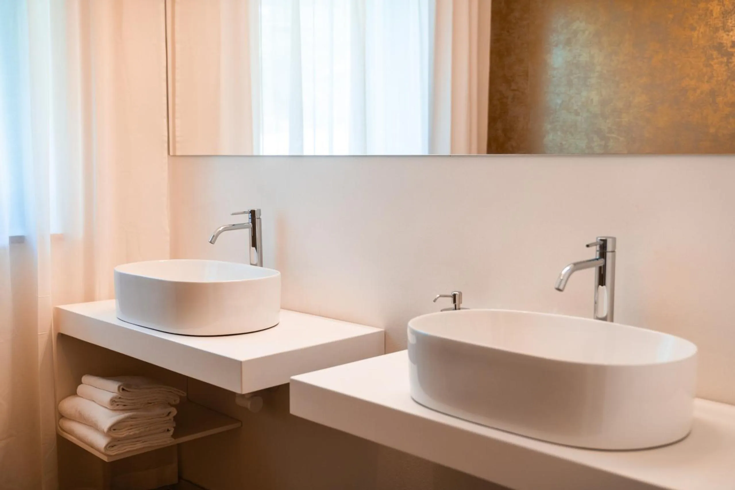 Bathroom in goldfinger + suites