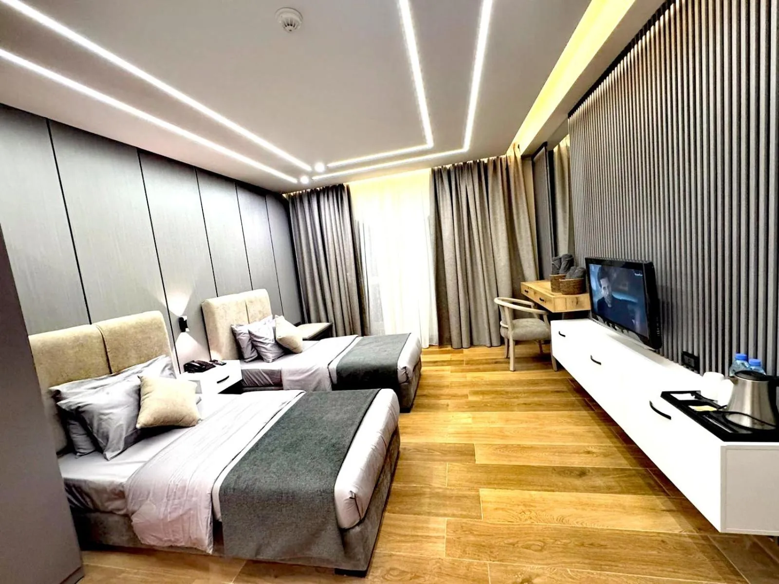 Bedroom in Queens Suite Hotel