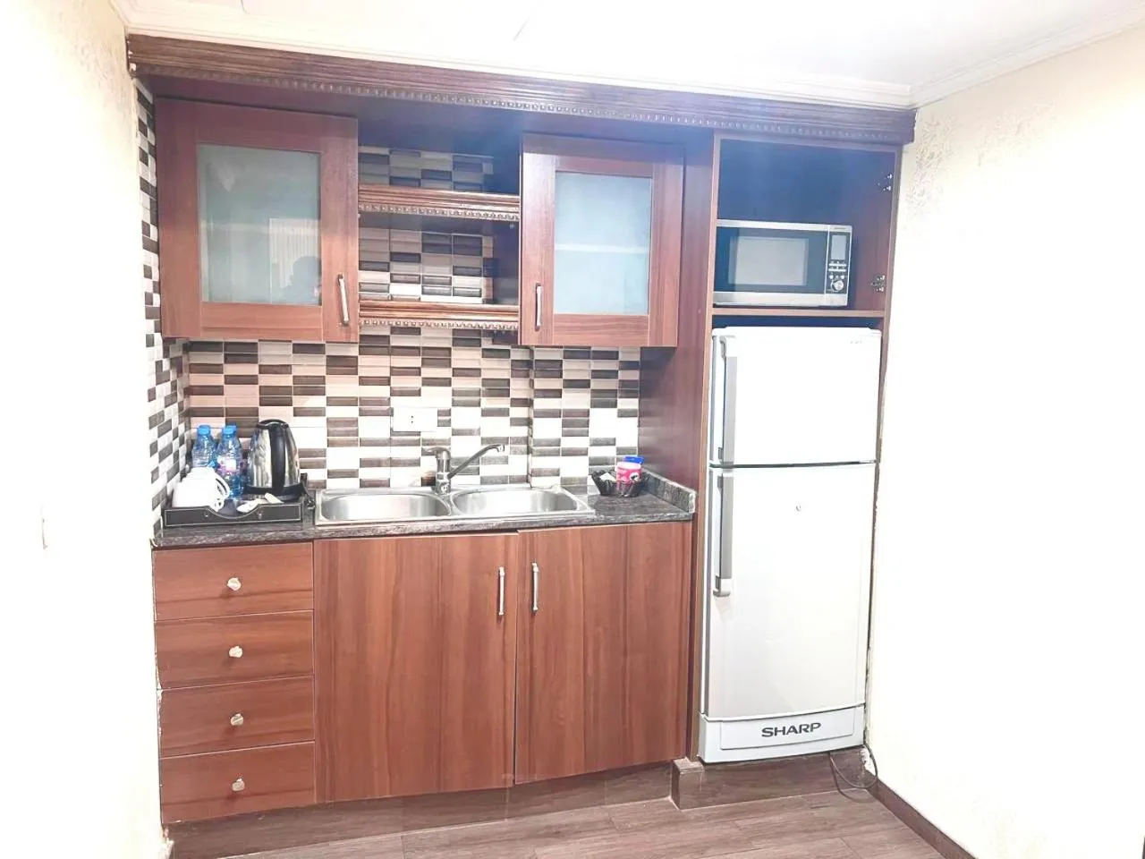 Kitchen or kitchenette in Queens Suite Hotel