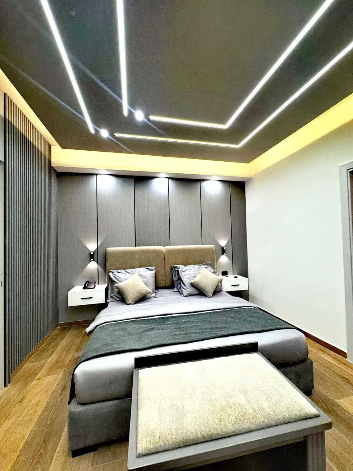 Bed in Queens Suite Hotel