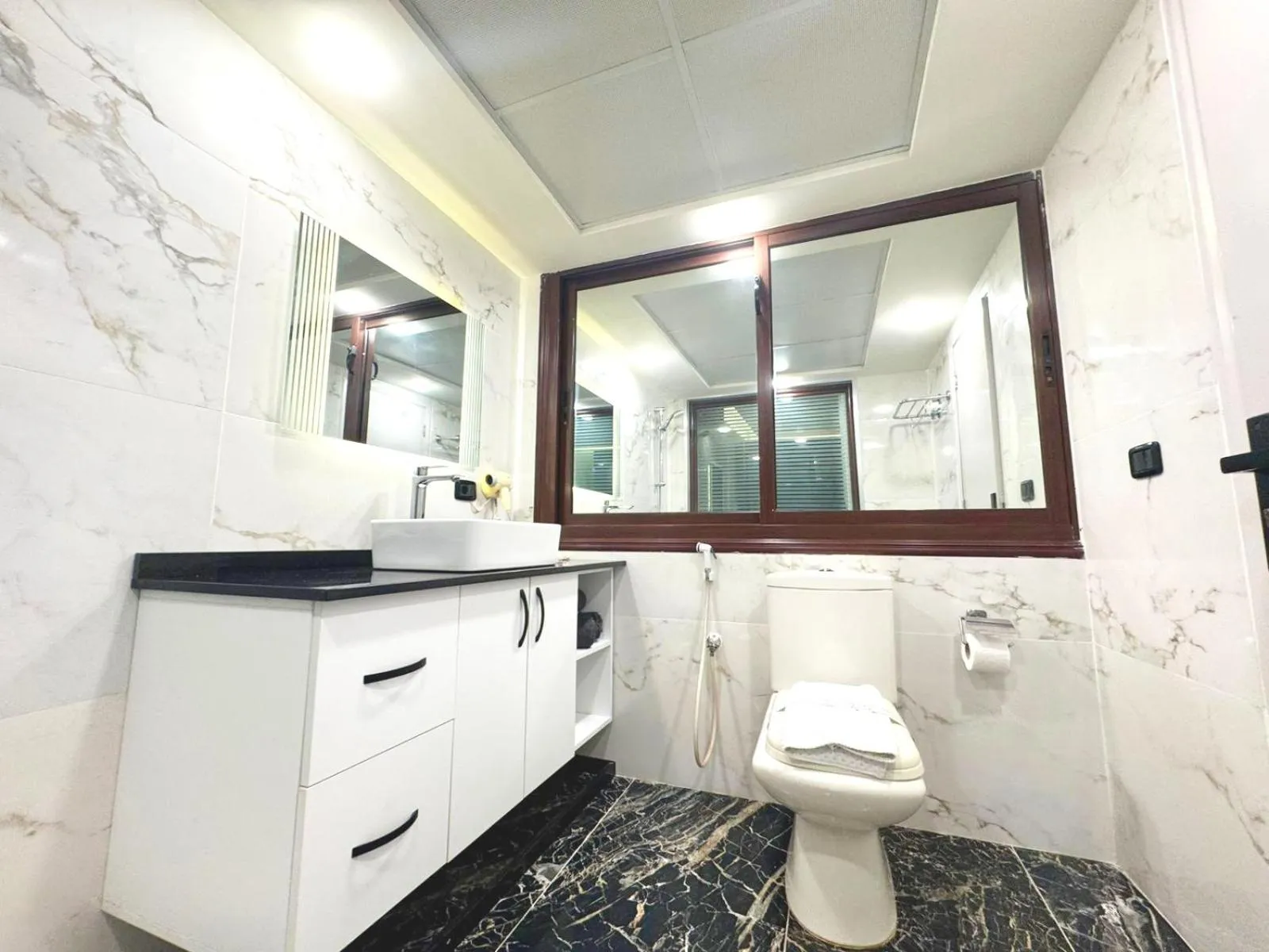 Bathroom in Queens Suite Hotel